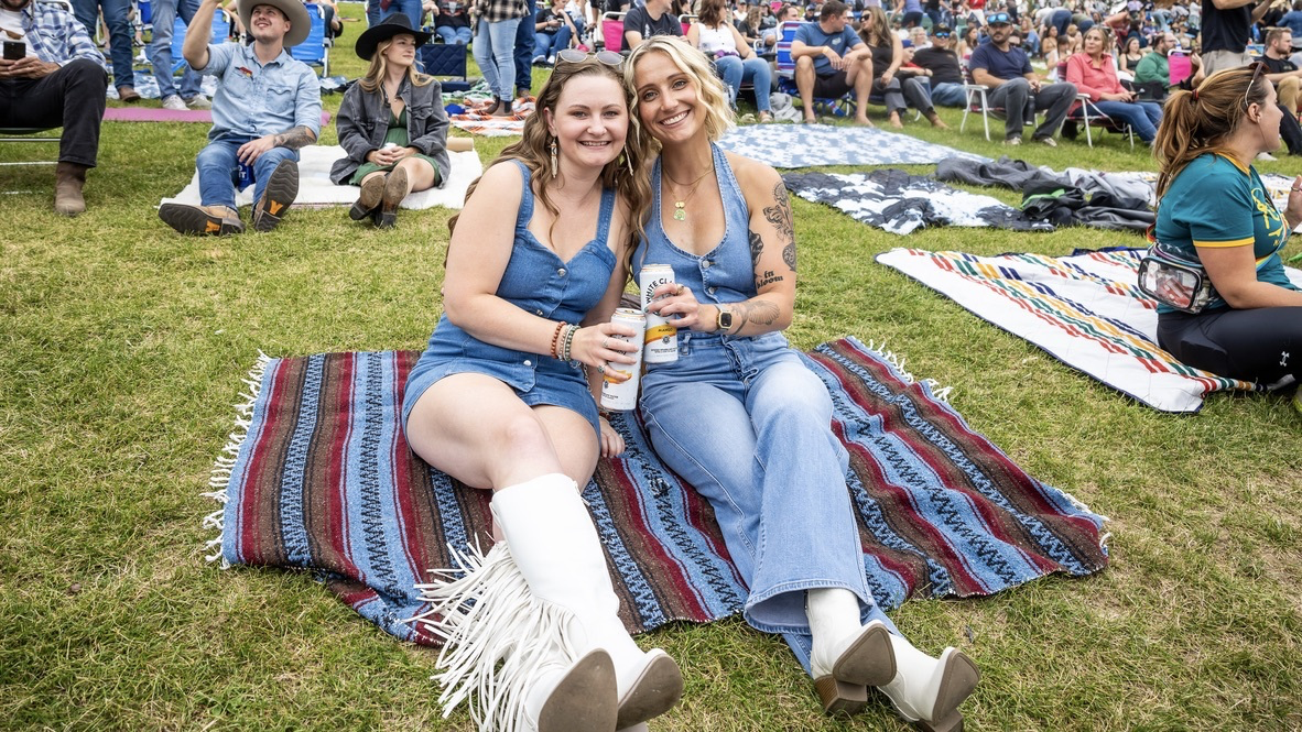 Attendees sitting on blanket