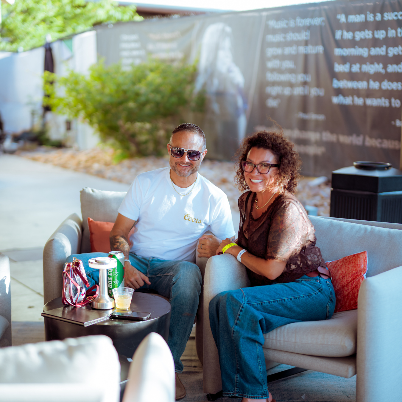 Two people sit in the VIP club, in armchairs