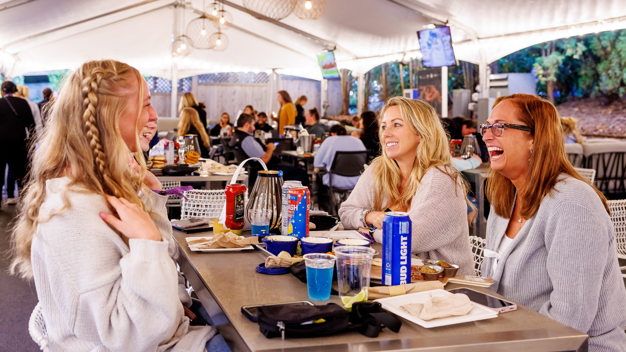 Sam Adams Club, 3 women eating and drinking