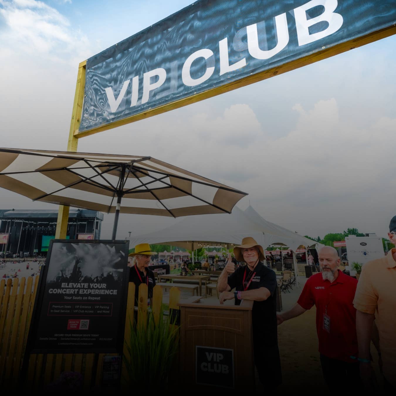 The VIP Club entrance sign with an umbrella underneath.