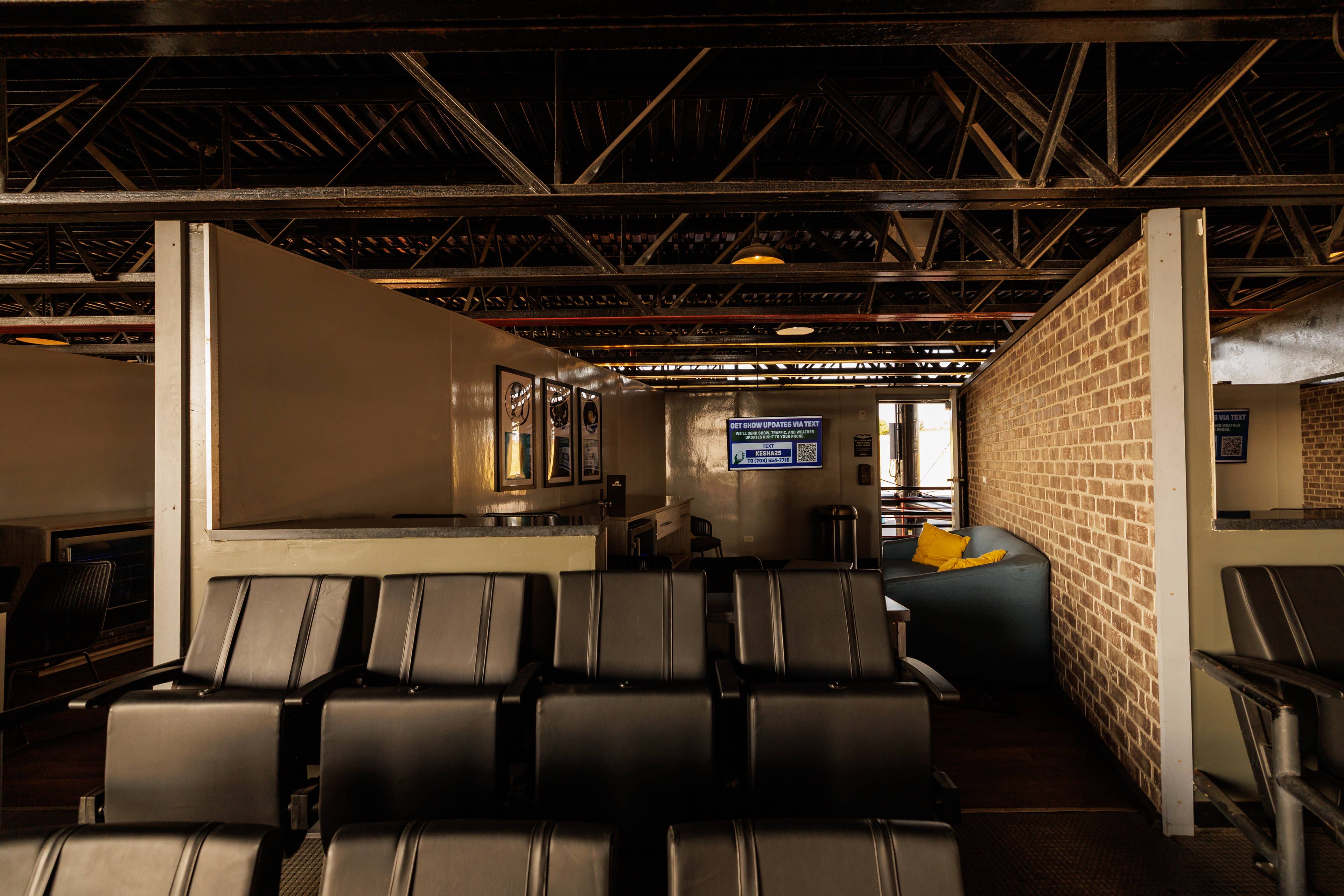 Image of premium seating area from the viewpoint of the stage with no one in the photo.