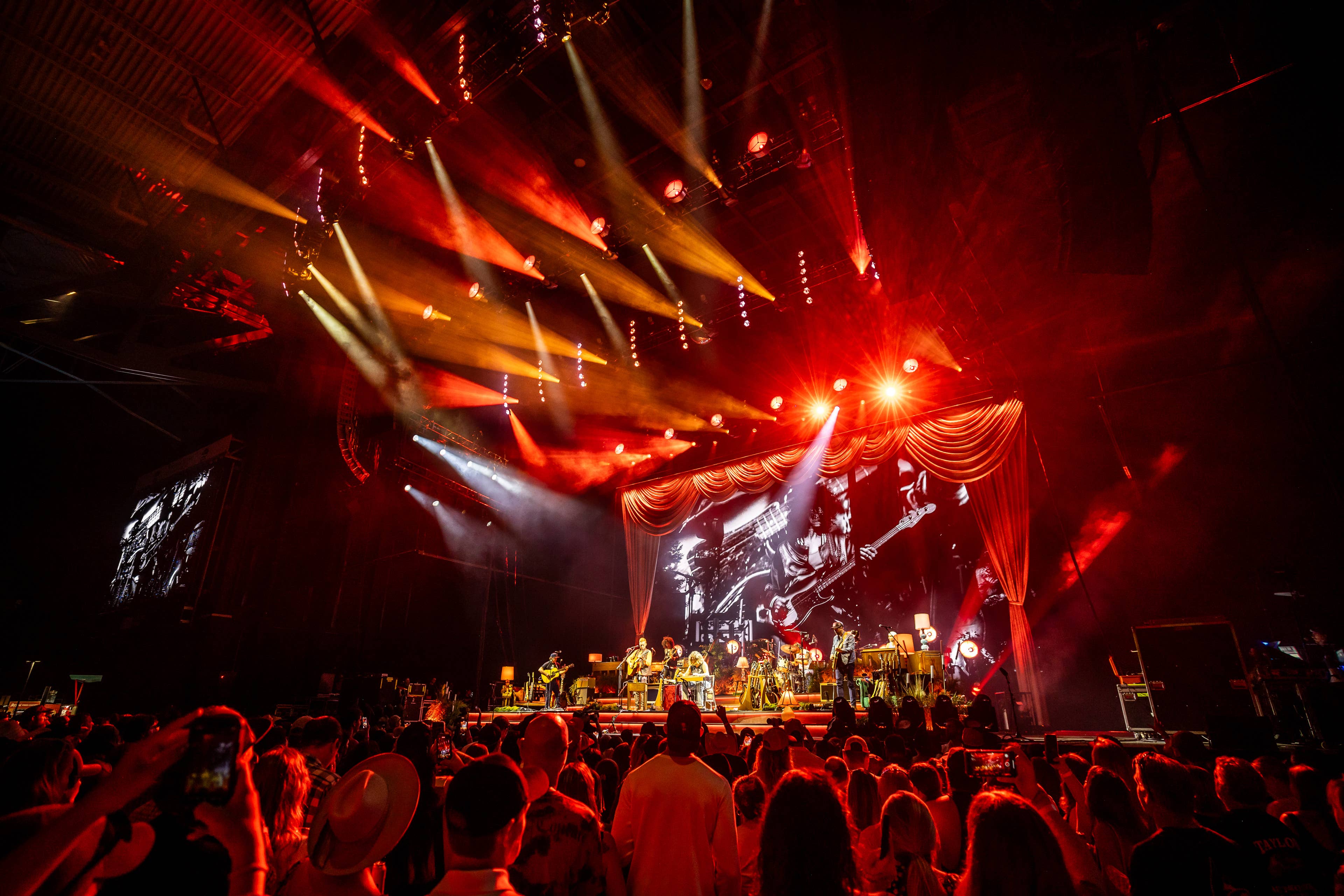 A landscape photo of the stage with Tyler Childers performing 