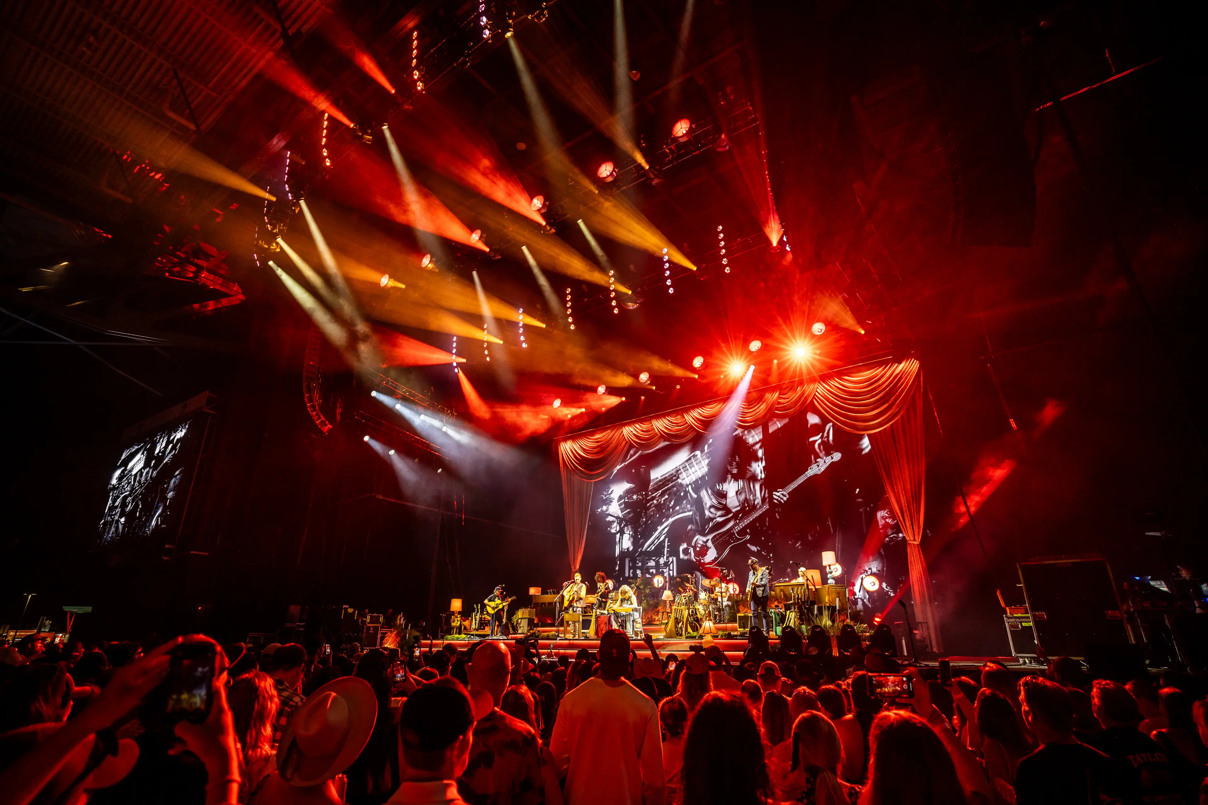 A landscape photo of the stage with Tyler Childers performing 