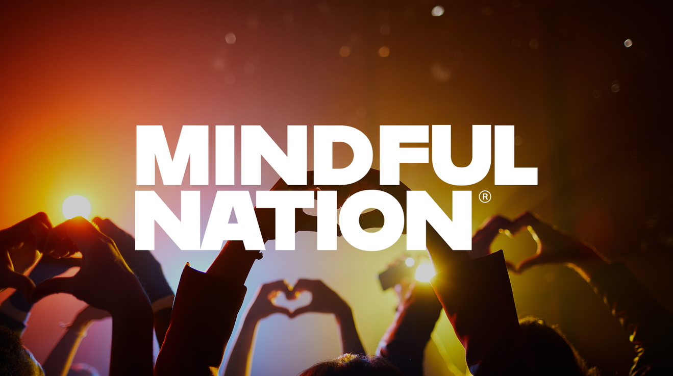An image with "MINDFUL" text visible in an orange/warm-toned concert setting