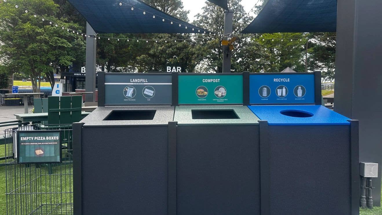 A photo of the trash cans at Truliant Amphitheater showing landfill, compost and recycle sections.