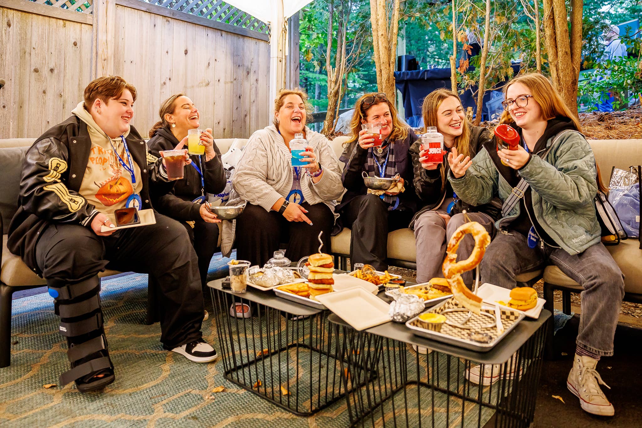 photo of 6 fans in the VIP club enjoying food and drinks
