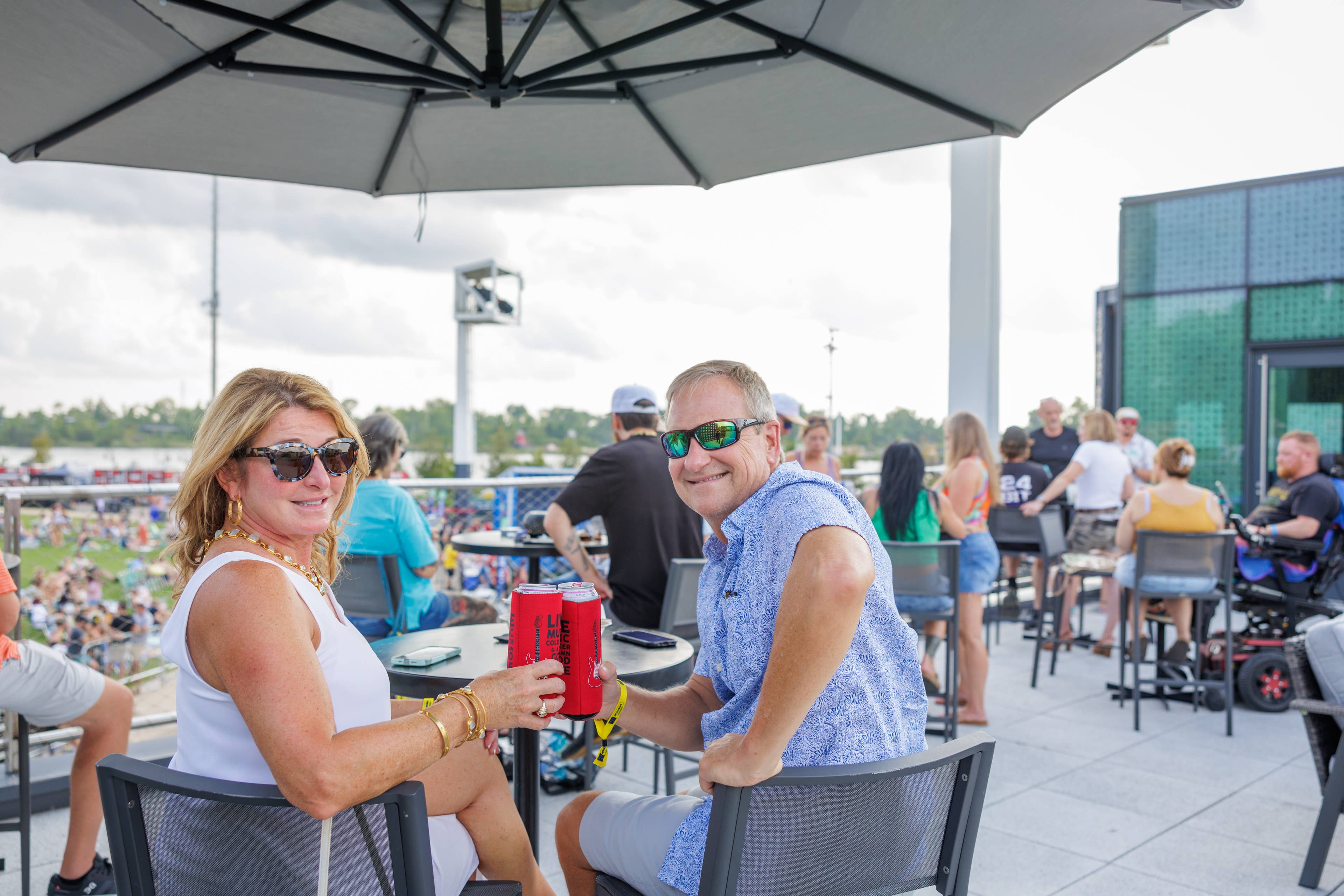 A man and woman sitting at a table in the VIP club.