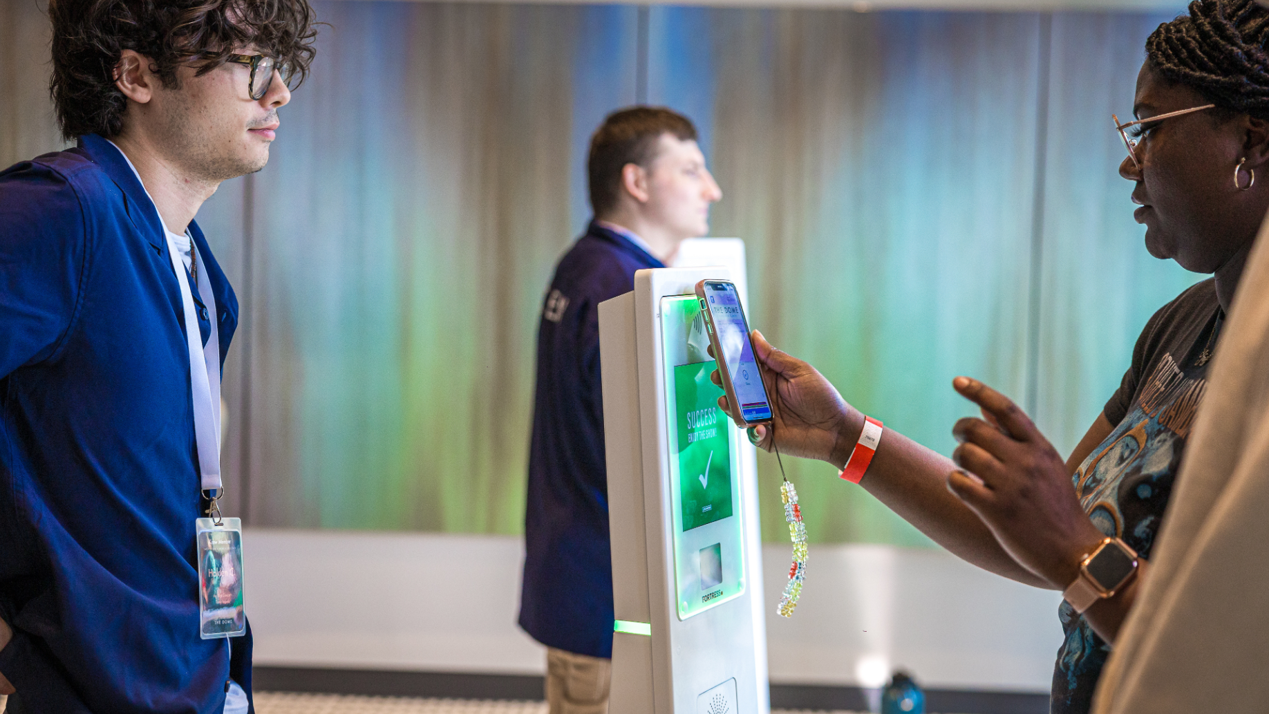 A fan scans their mobile ticket to enter the venue.
