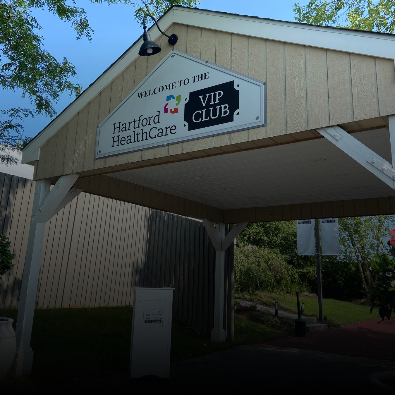 A sign to the entrance of the VIP Club at Xfinity Theatre