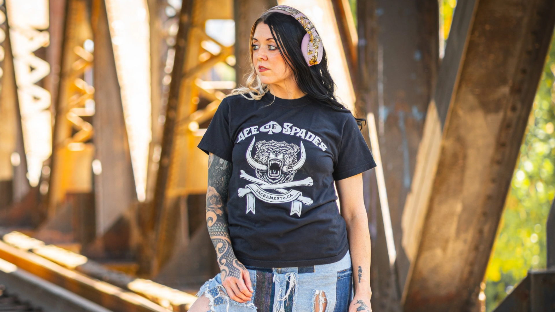 A woman wearing Ace of Spades merch