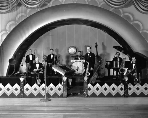 Black and white image of artists performing on stage