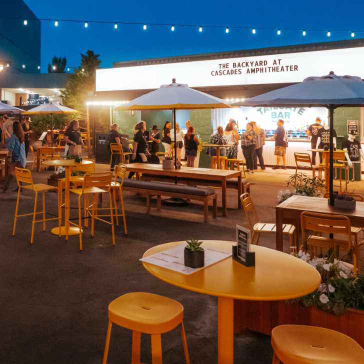 Open air outside club with lights and food