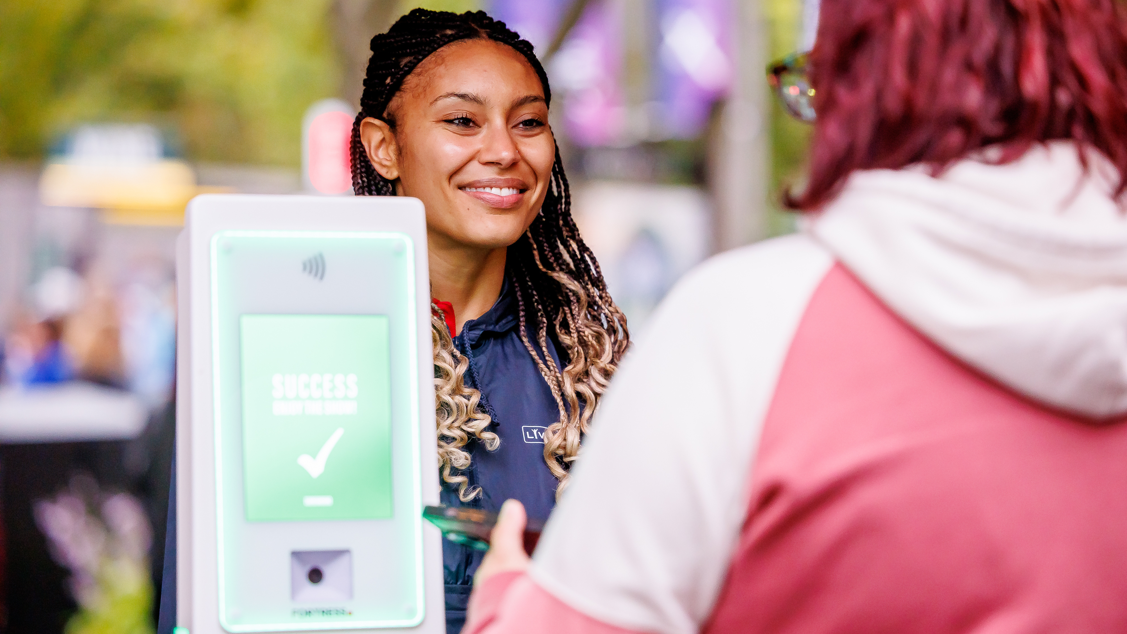 A guest service scanning tickets 