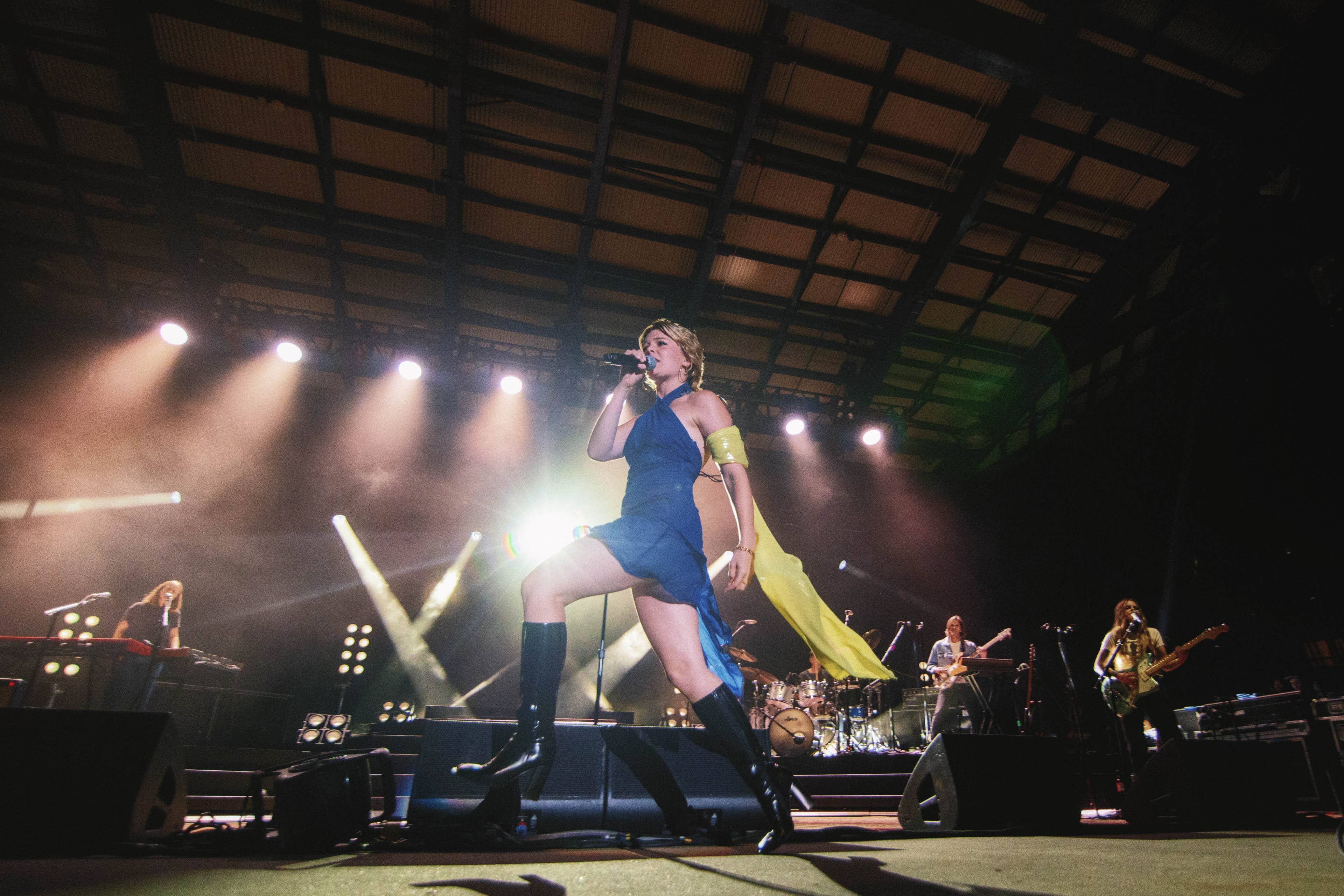 A picture of Maggie Rogers performing at Skyla Credit Union Amphitheatre.