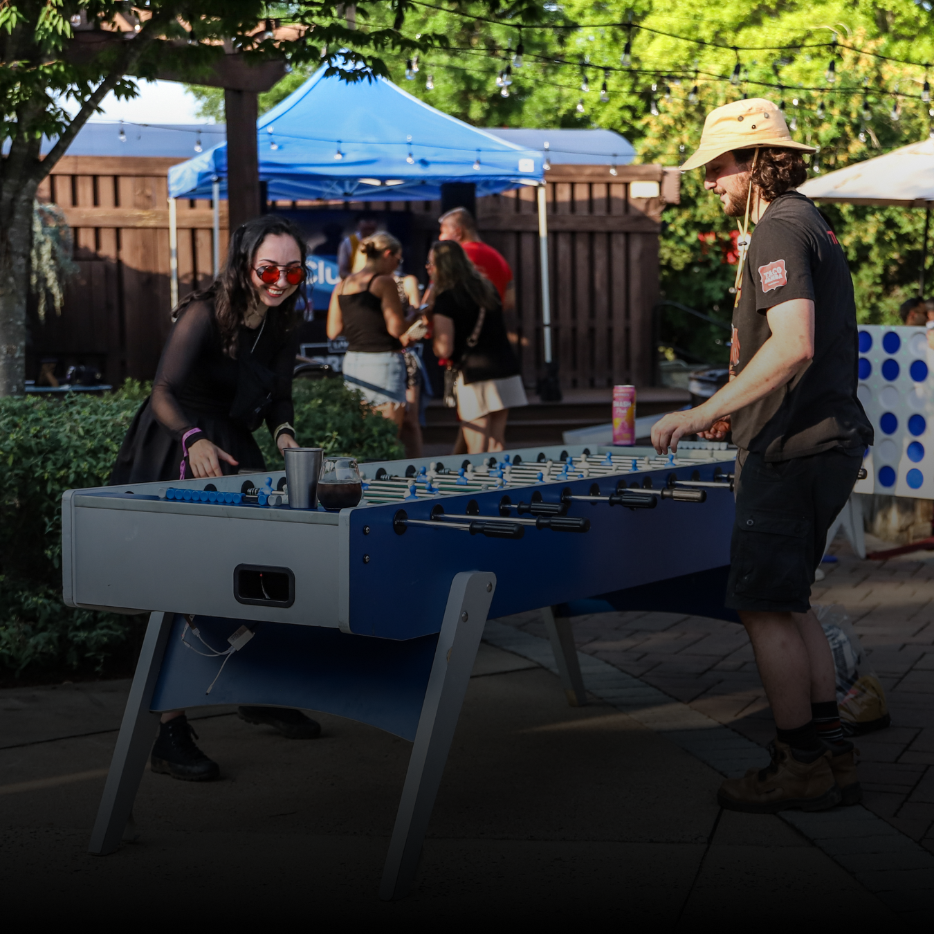 A man and woman playing table football.