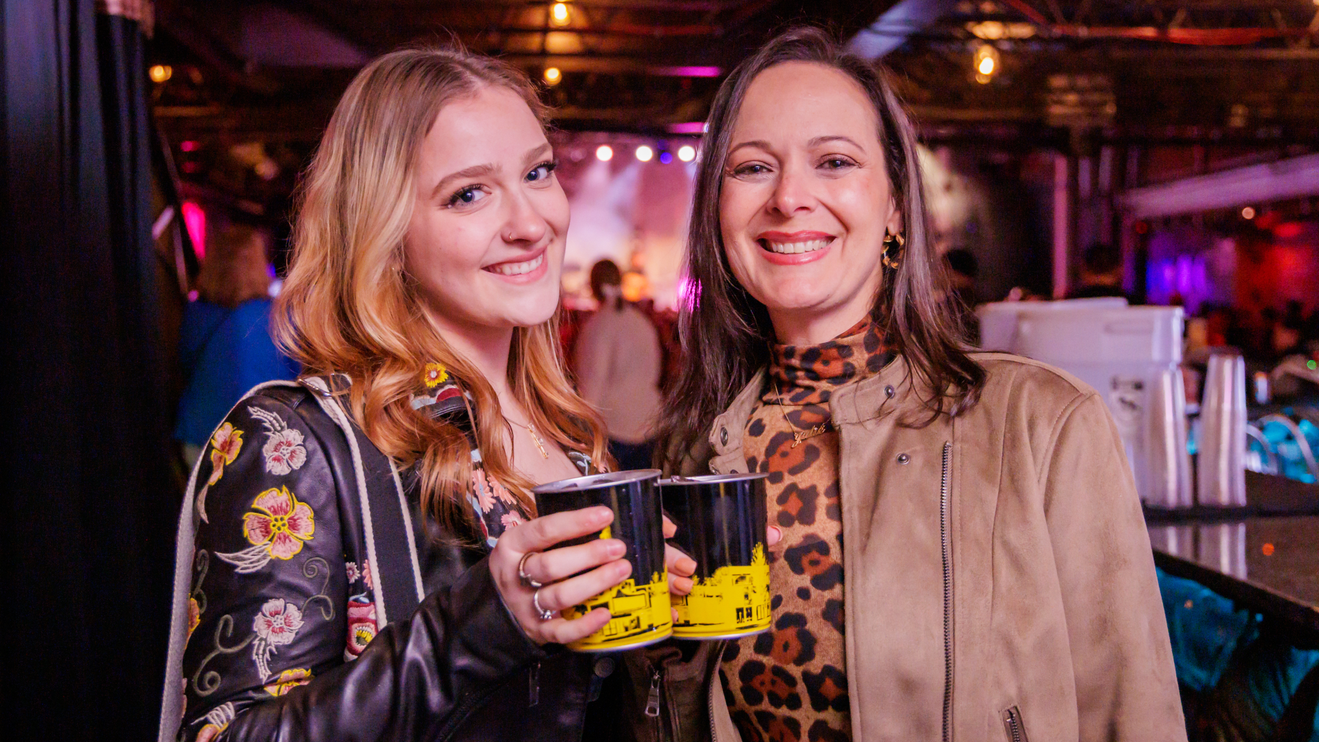 Two fans enjoy their drinks at Varsity Theater.