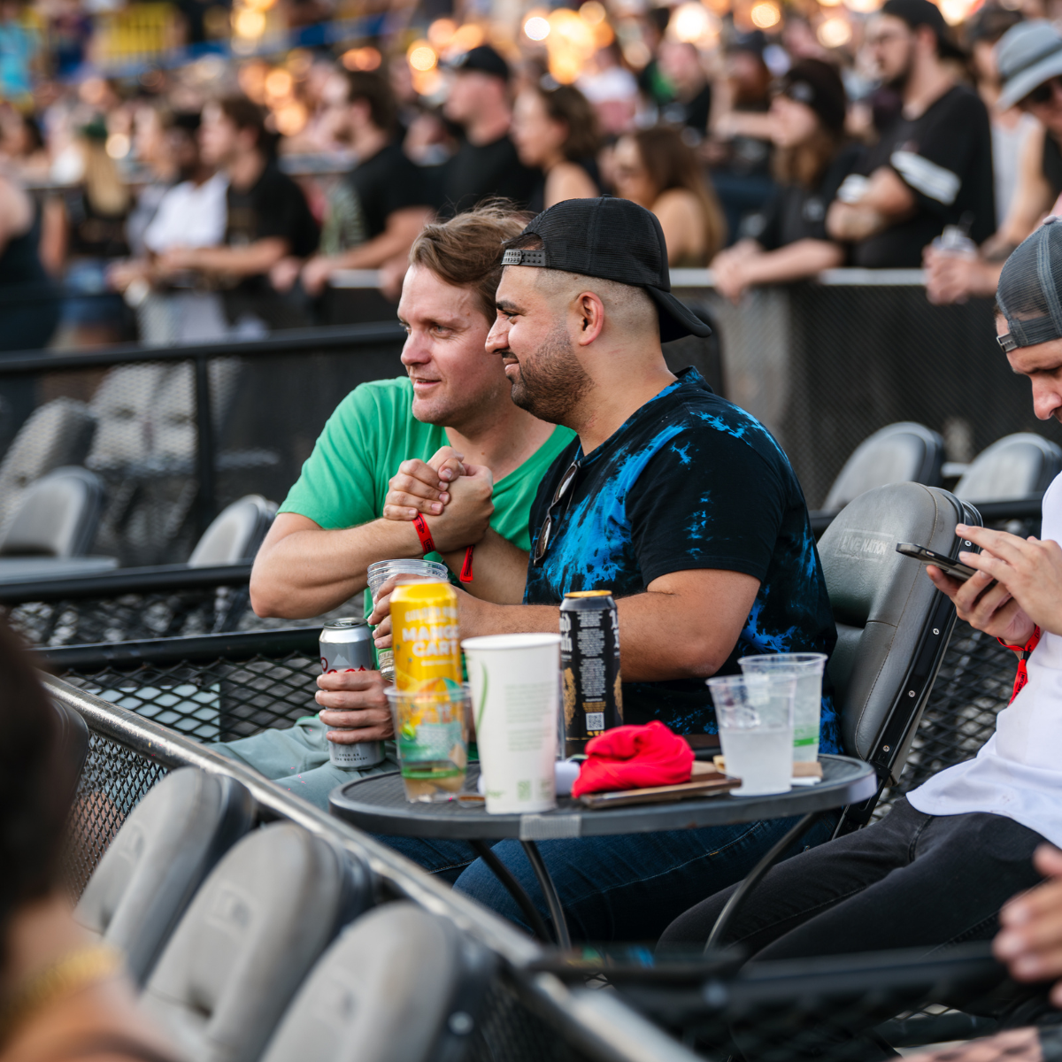 two men happy with their seats