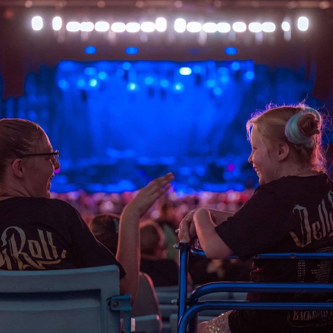 Two people talking to each other in seats