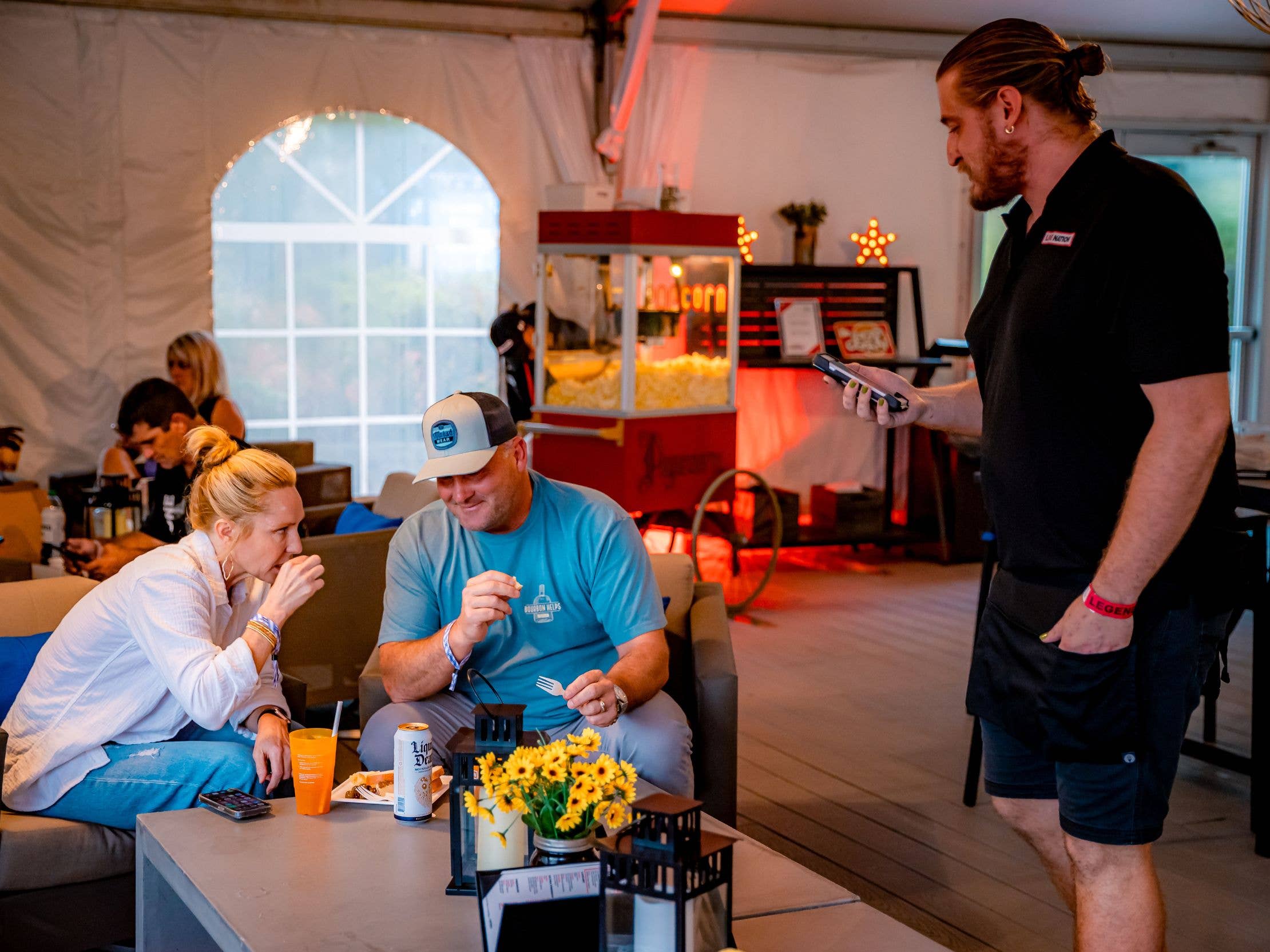 A VIP Club server is asking guests what they would like to order