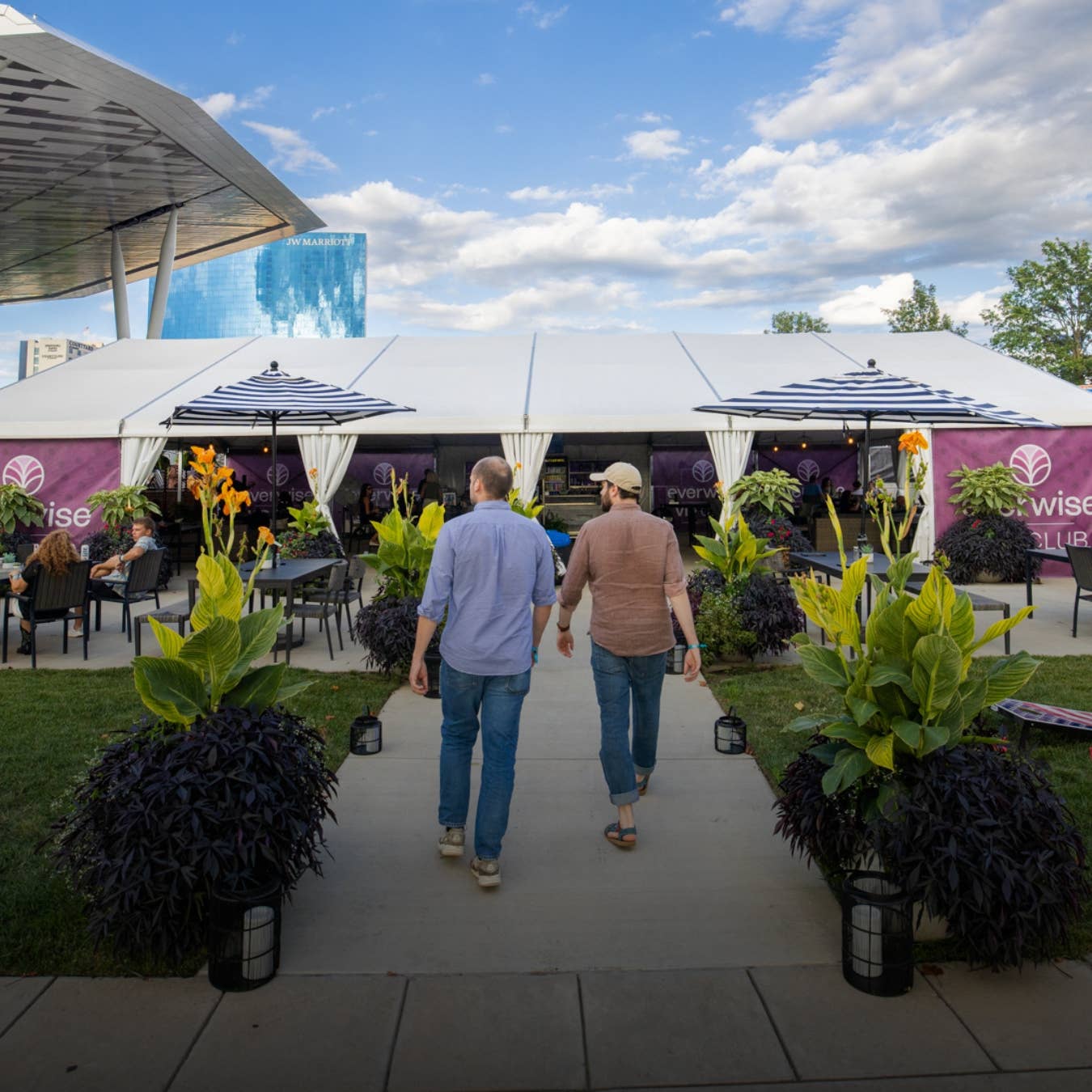Two fans walking into the VIP Club at Everwise Amphitheater