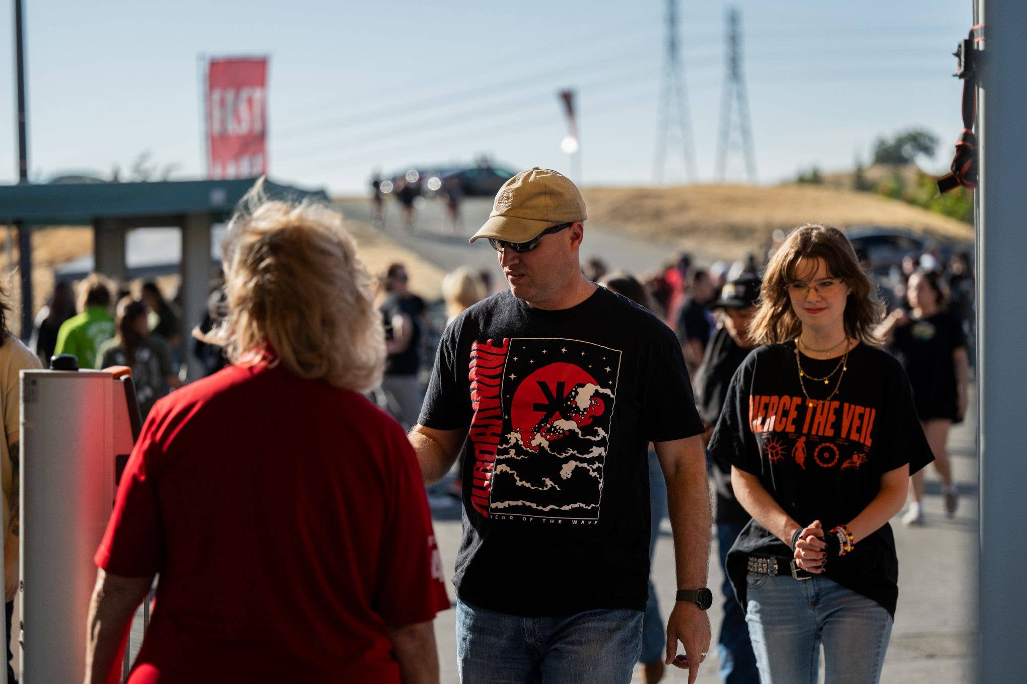 People are seen scannign their tickets at the entrance and coming into the gates