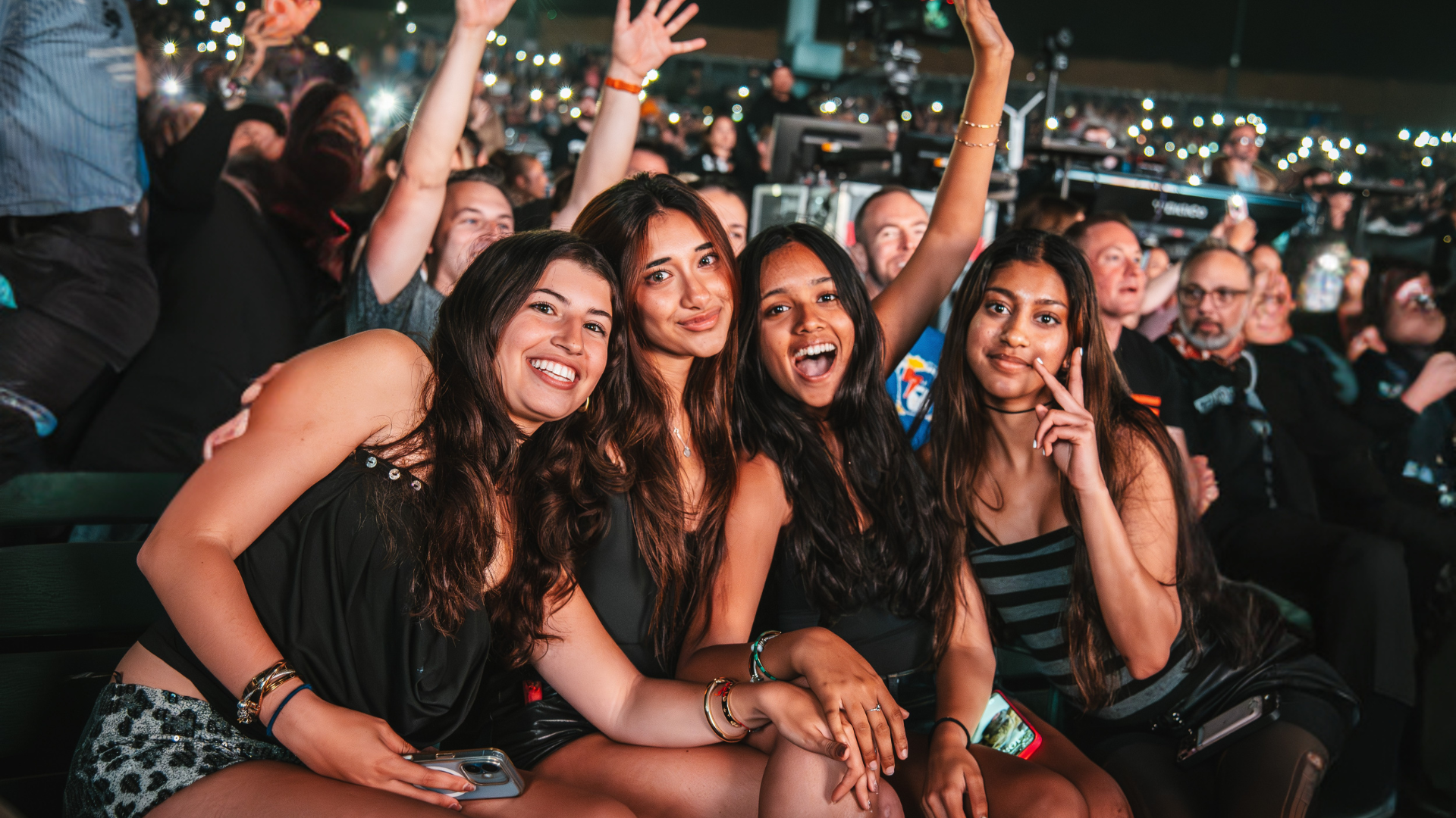 a group of girls enjoying the show