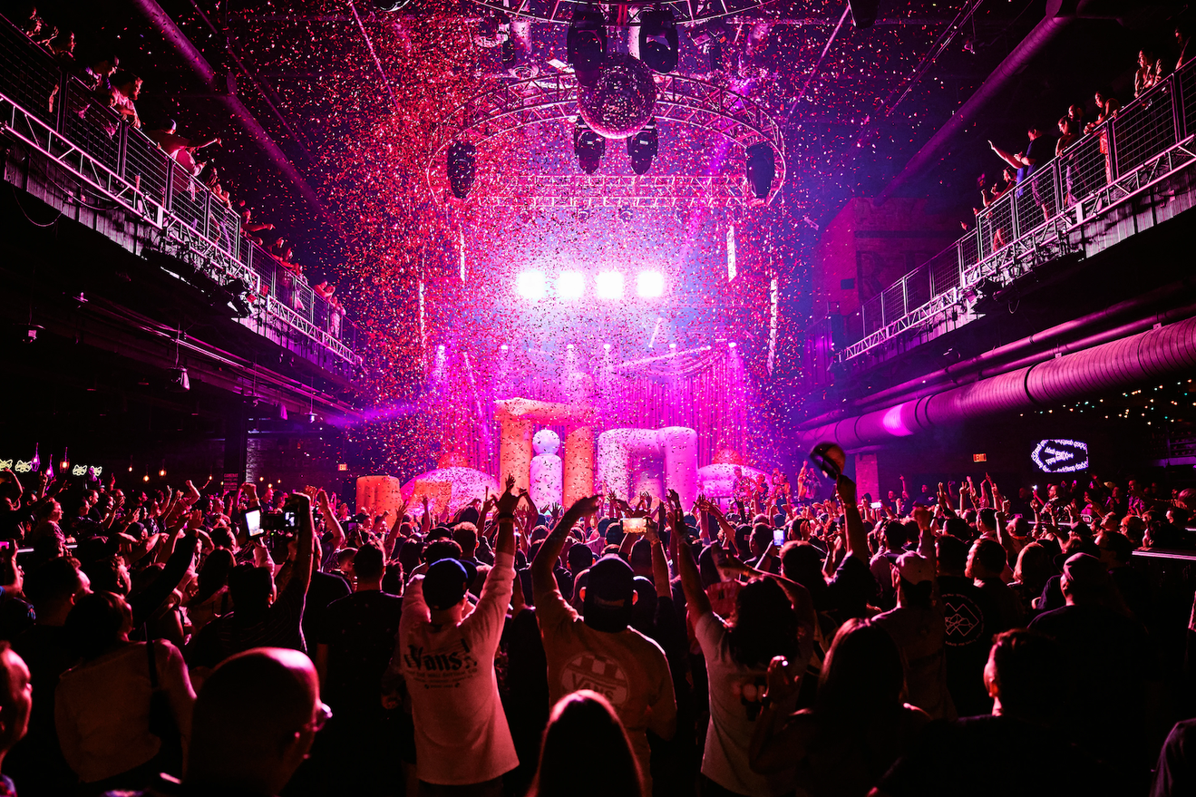 A crowd watching an event on stage
