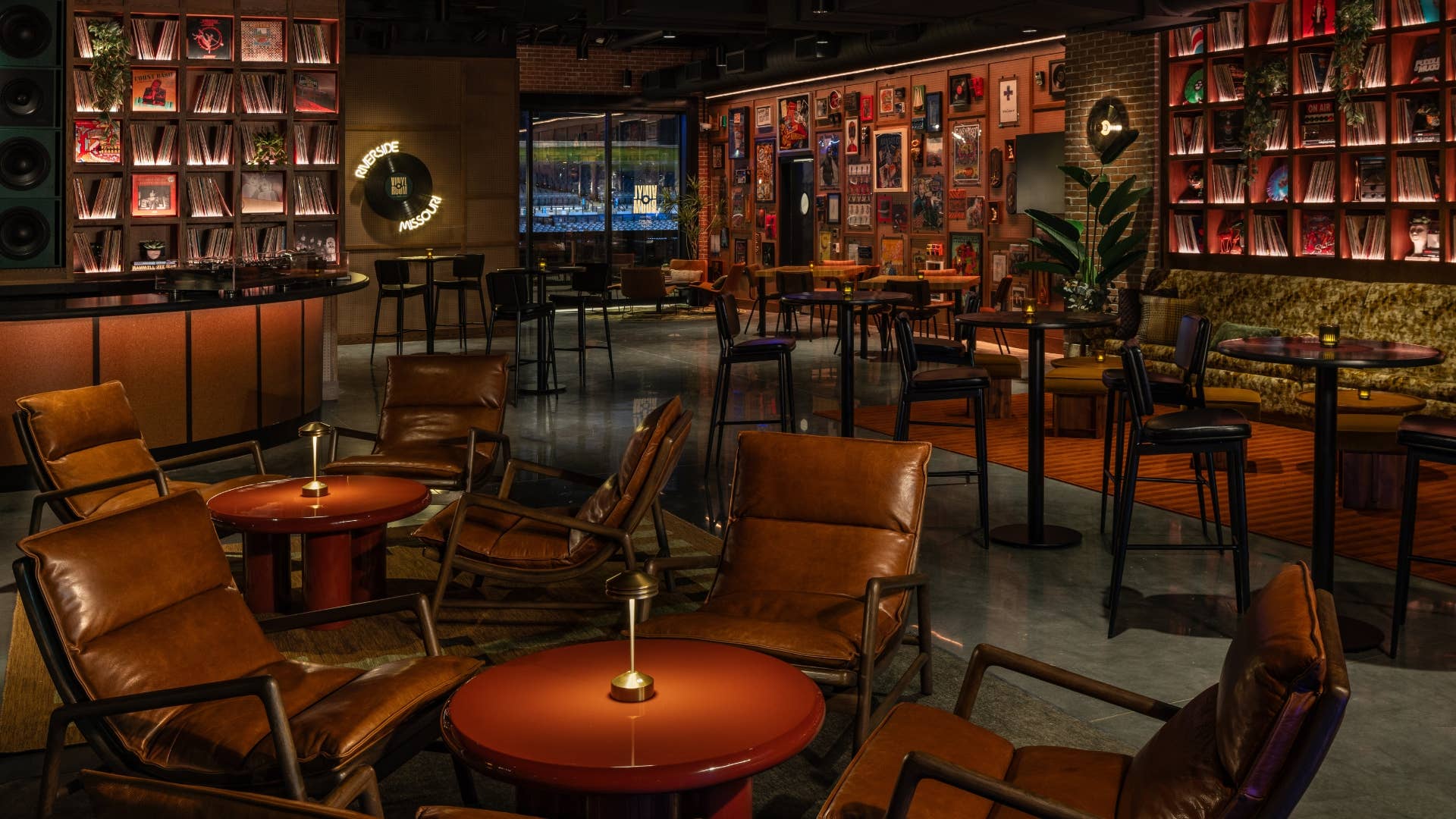 A view of the Vinyl Room area, showing all the tables and chairs and really unique decor on the walls.