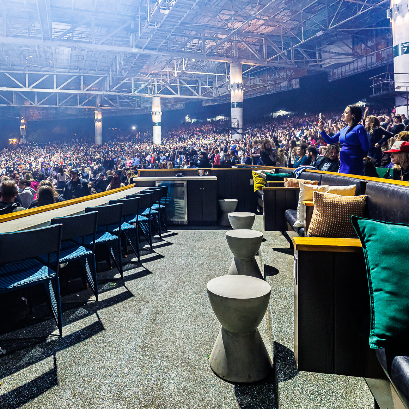 An empty Rock Box Premium seating area in a filled amphitheater