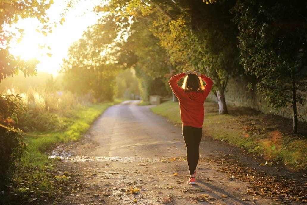 A person walking on an outdoor trail. 