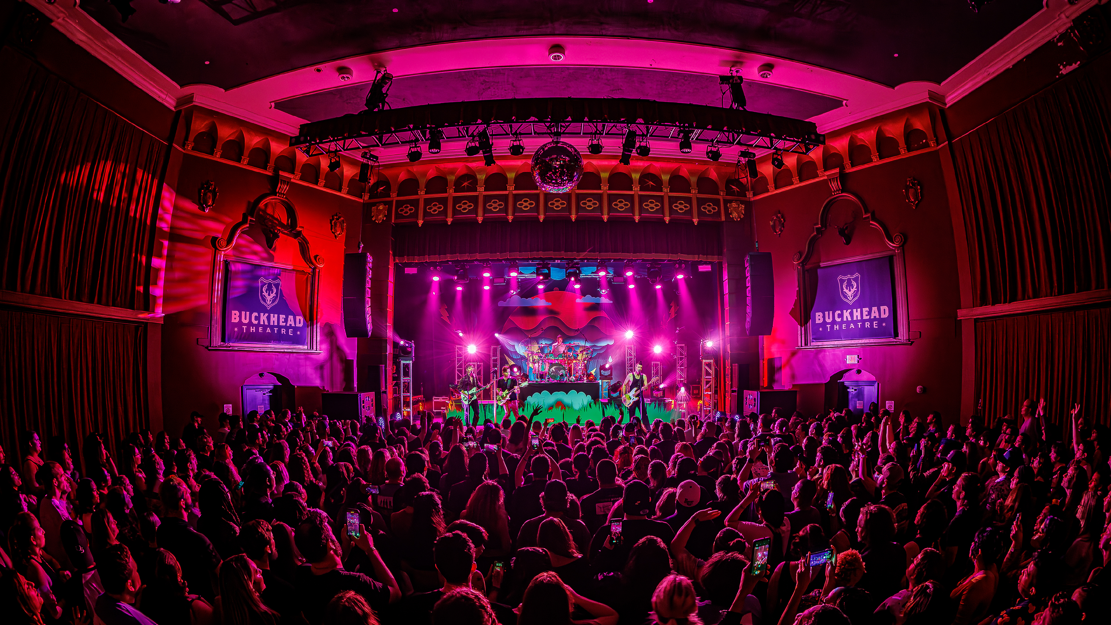 A wide view of full crowd inside of Buckhead Theatre during a rock band performance