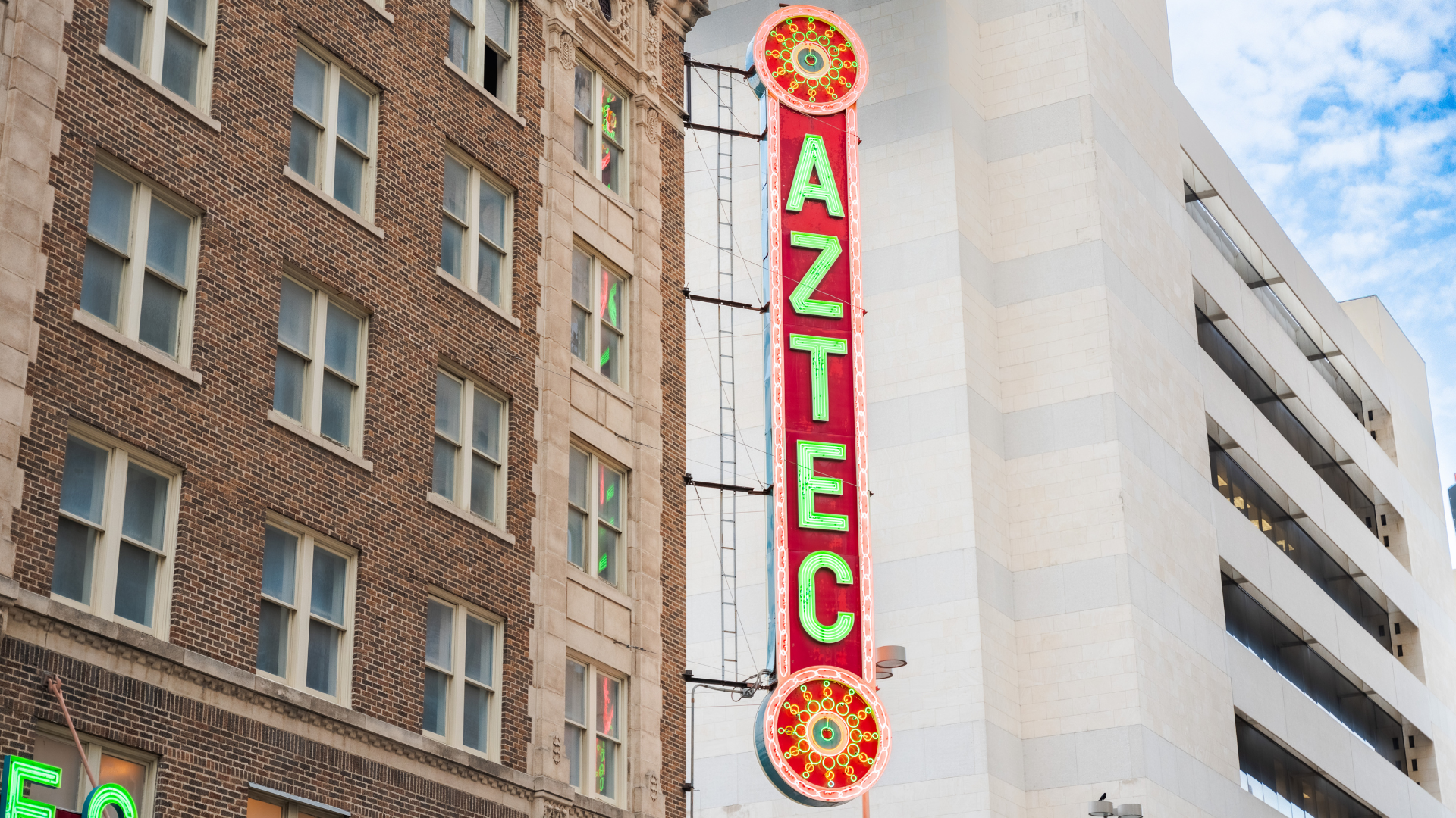 Photo of the Aztec Theatre neon sign "Aztec" on the side of the building