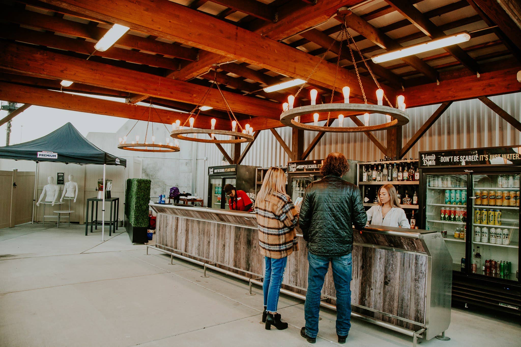 A photo of two fans being helped at a concession stand 