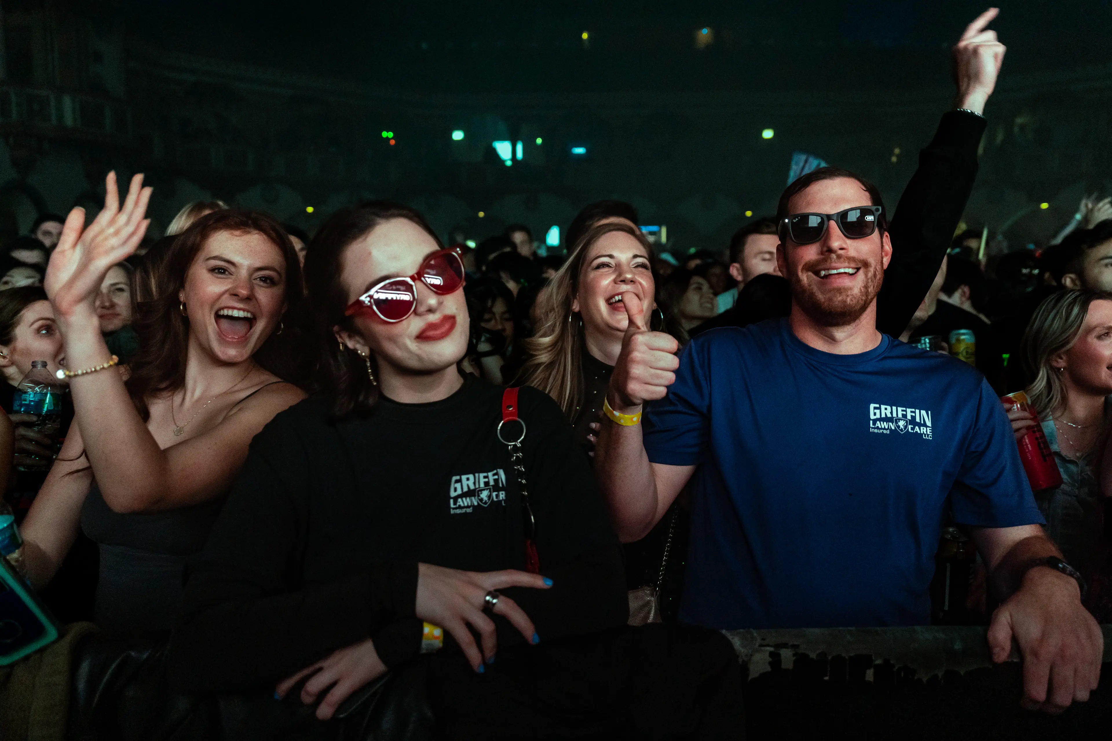 Fans smiling at the camera