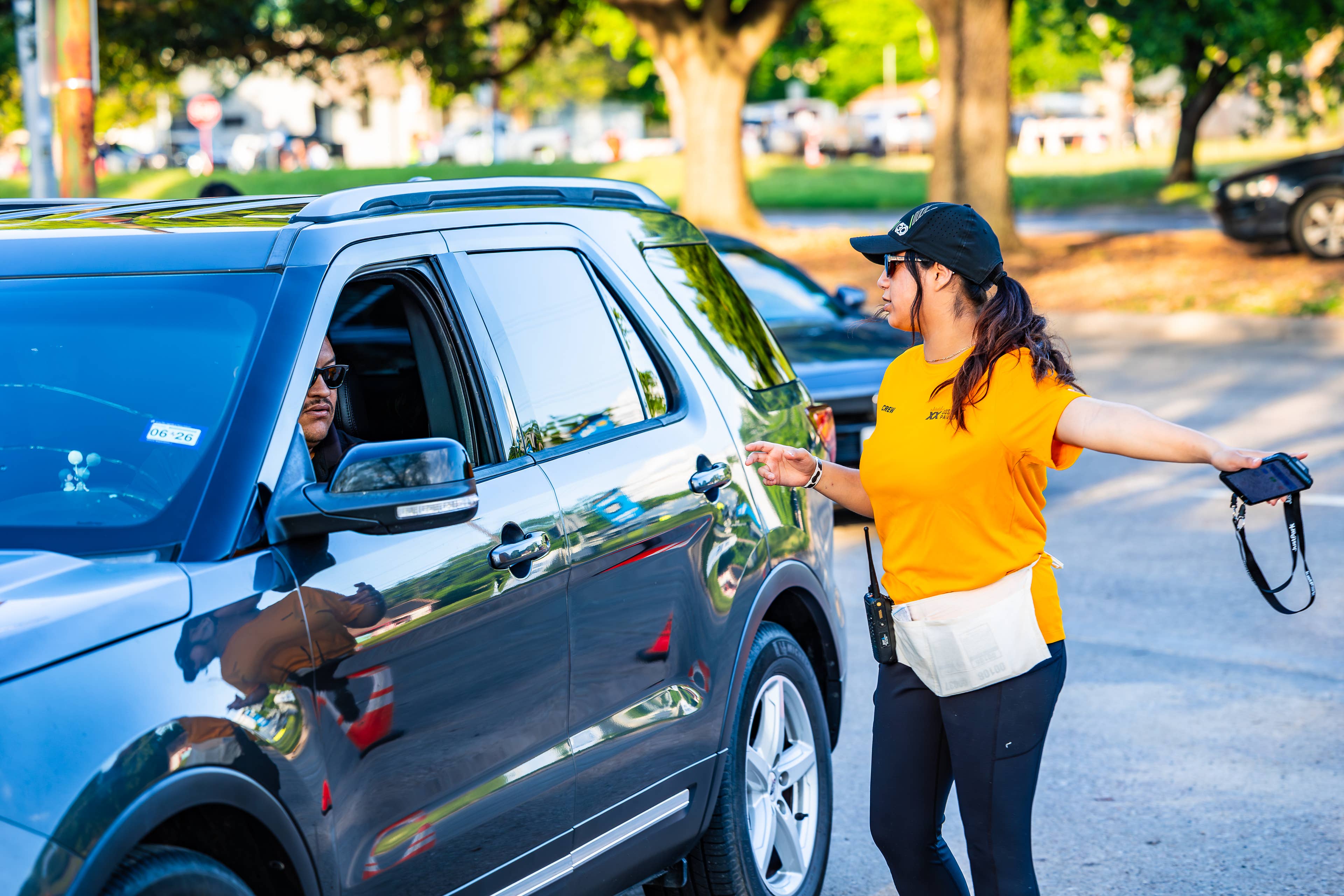 Photo of an employee directing a car where to park.
Live Nation presents Peso Pluma at Dos Equis Pavilion in Dallas, Texas on April 10, 2026. (Photo by ALIVE for Live Nation)