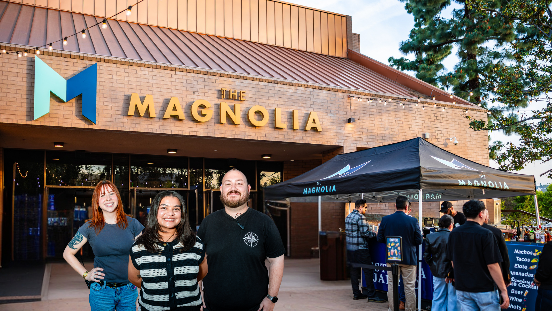 employees in front of mag