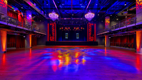 A view of the venue floor and stage when the venue is empty