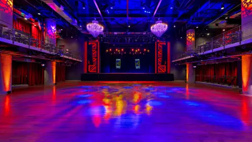A view of the venue floor and stage when the venue is empty