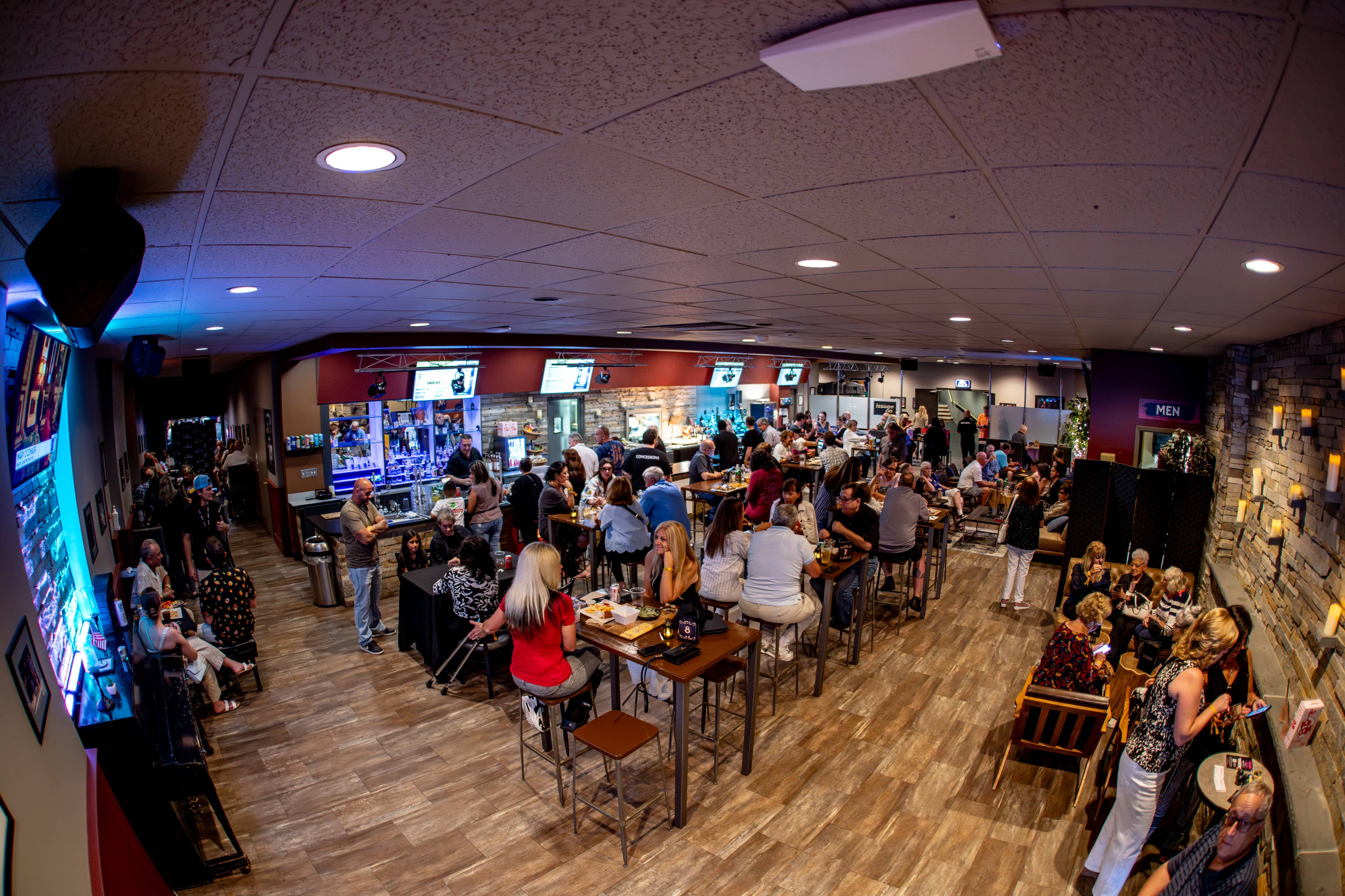 People sitting at tables in the Lounge 960 area