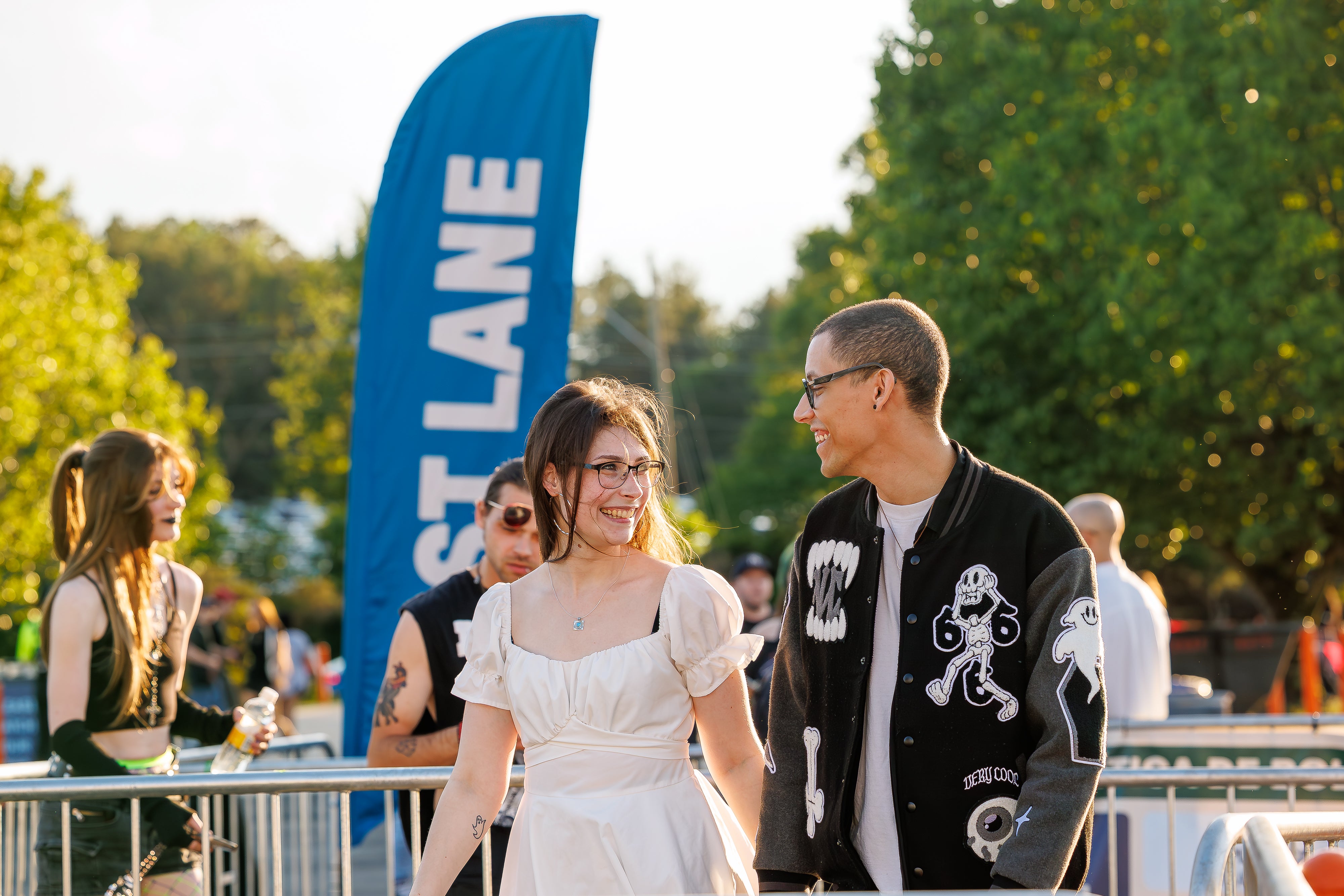 A man and a women walking up in the Truliant fast lane line.
