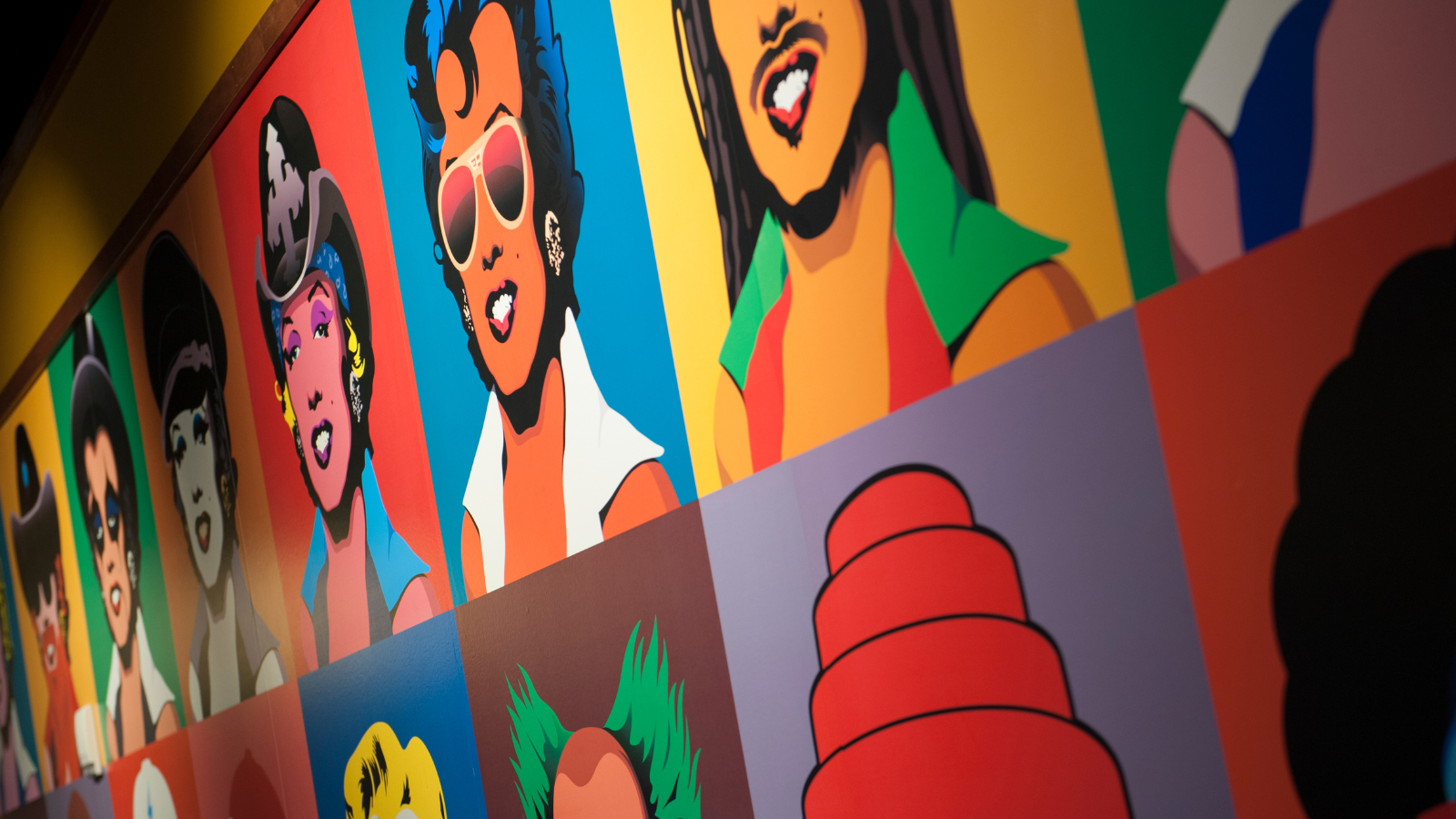 A painted colorful mural that is located inside the lobby of the venue.