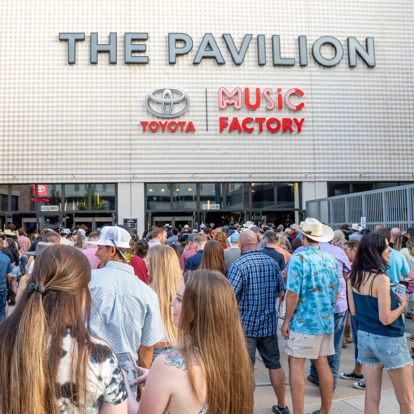 The exterior of the building with the The Pavilion Toyota Music Factory logo