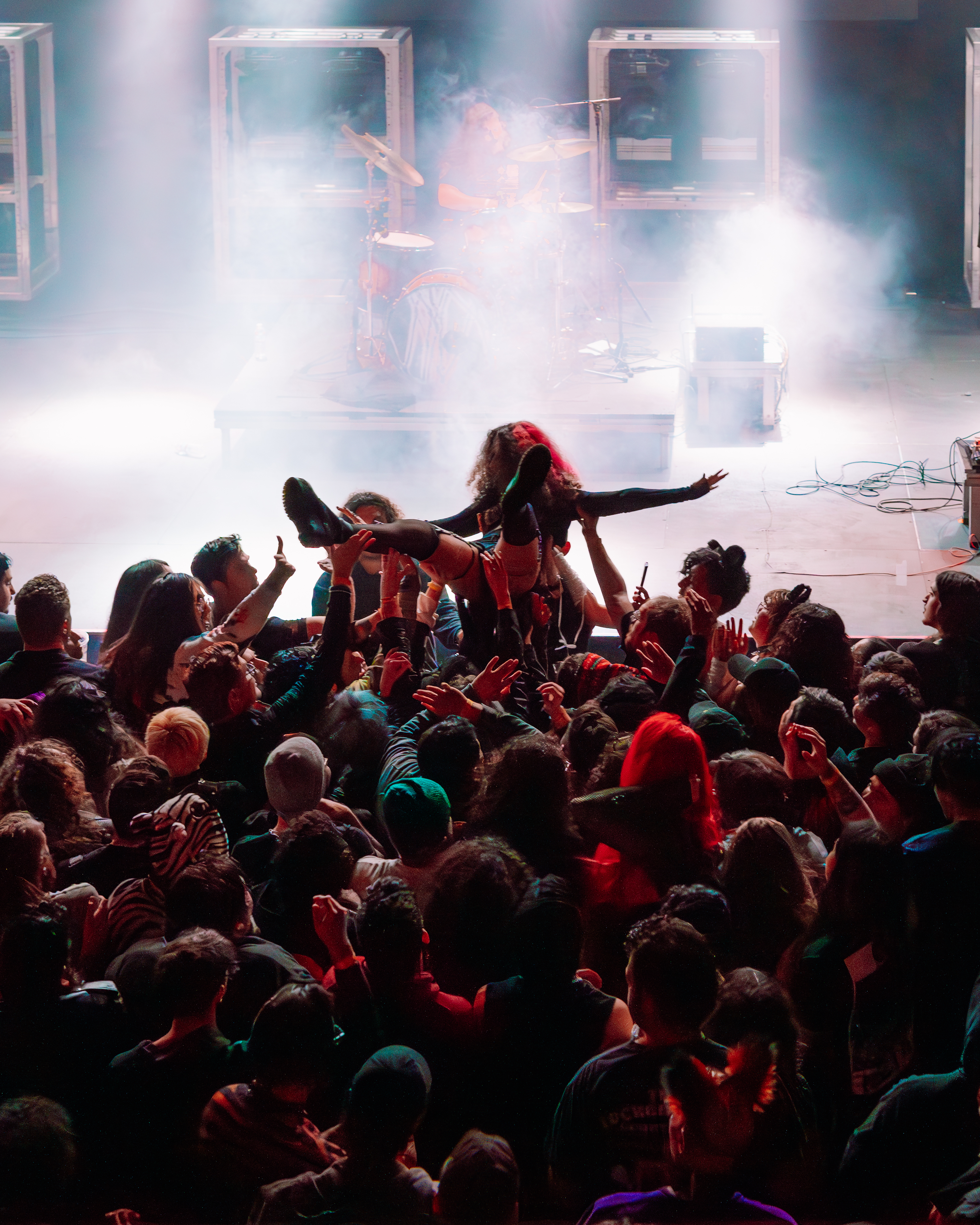Someone crowd surfing at Belasco
