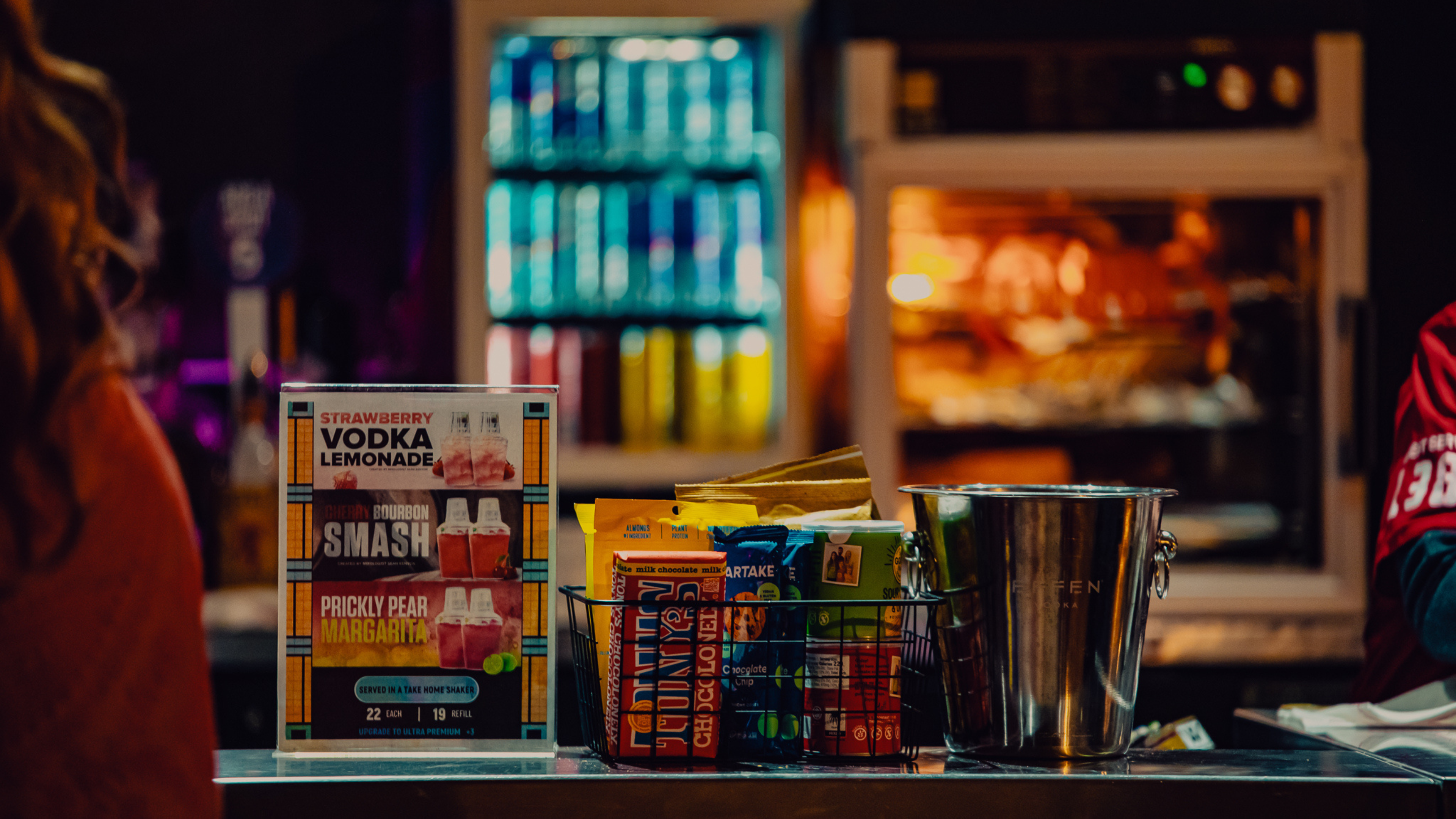 Drinks and assorted snacks are displayed on a bar inside Byline Bank Aragon Ballroom.
