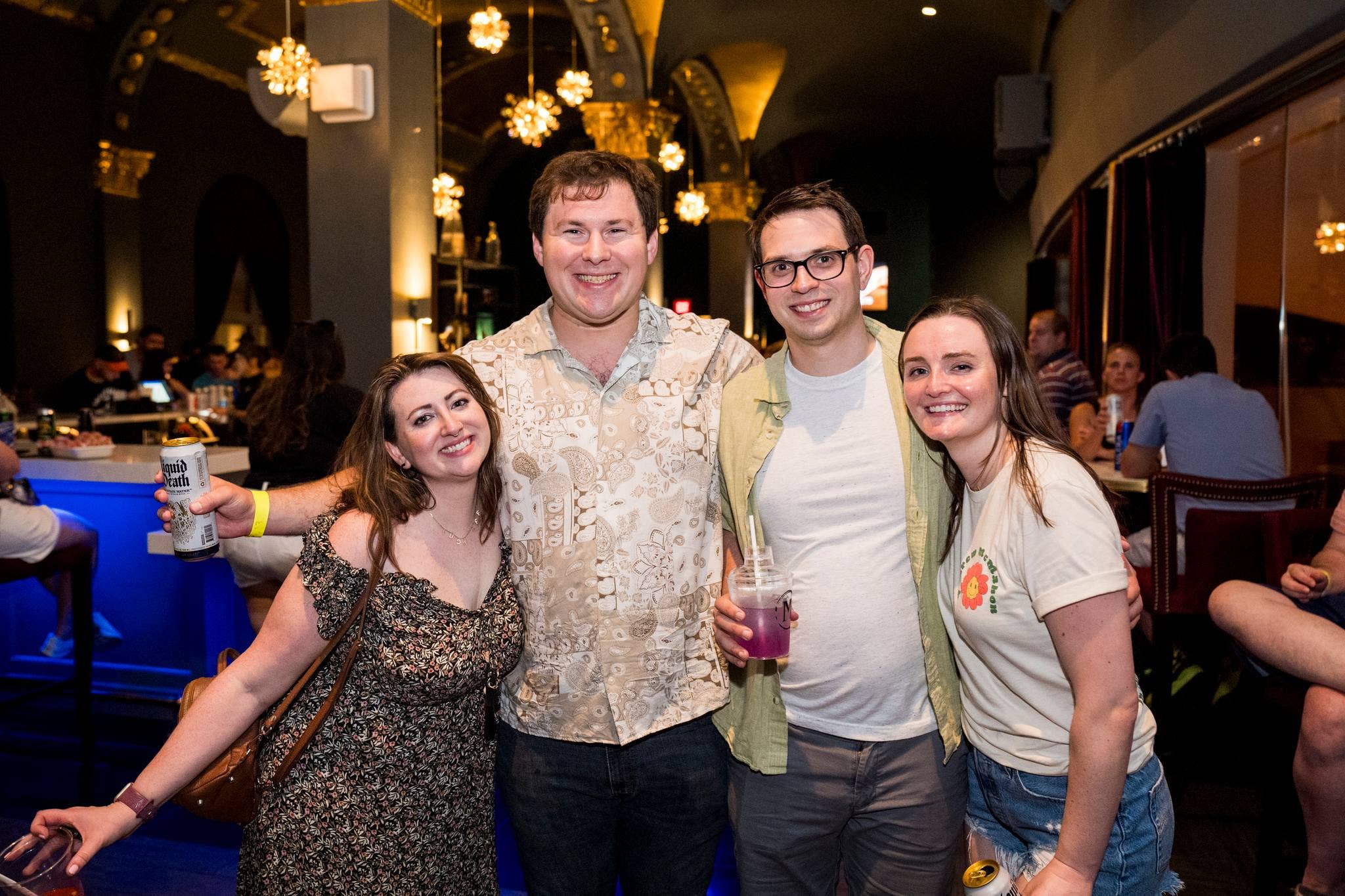 Four people smiling at the camera