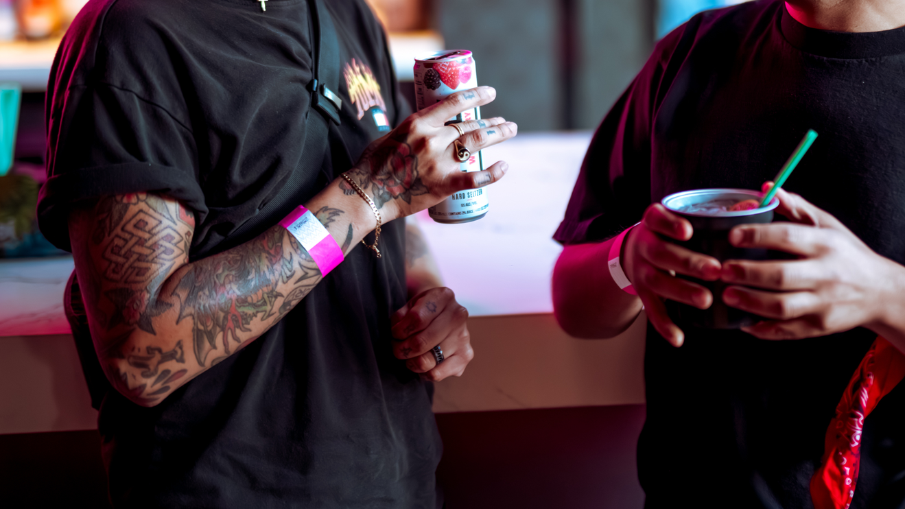 Two people enjoy their drinks at Ace of Spades