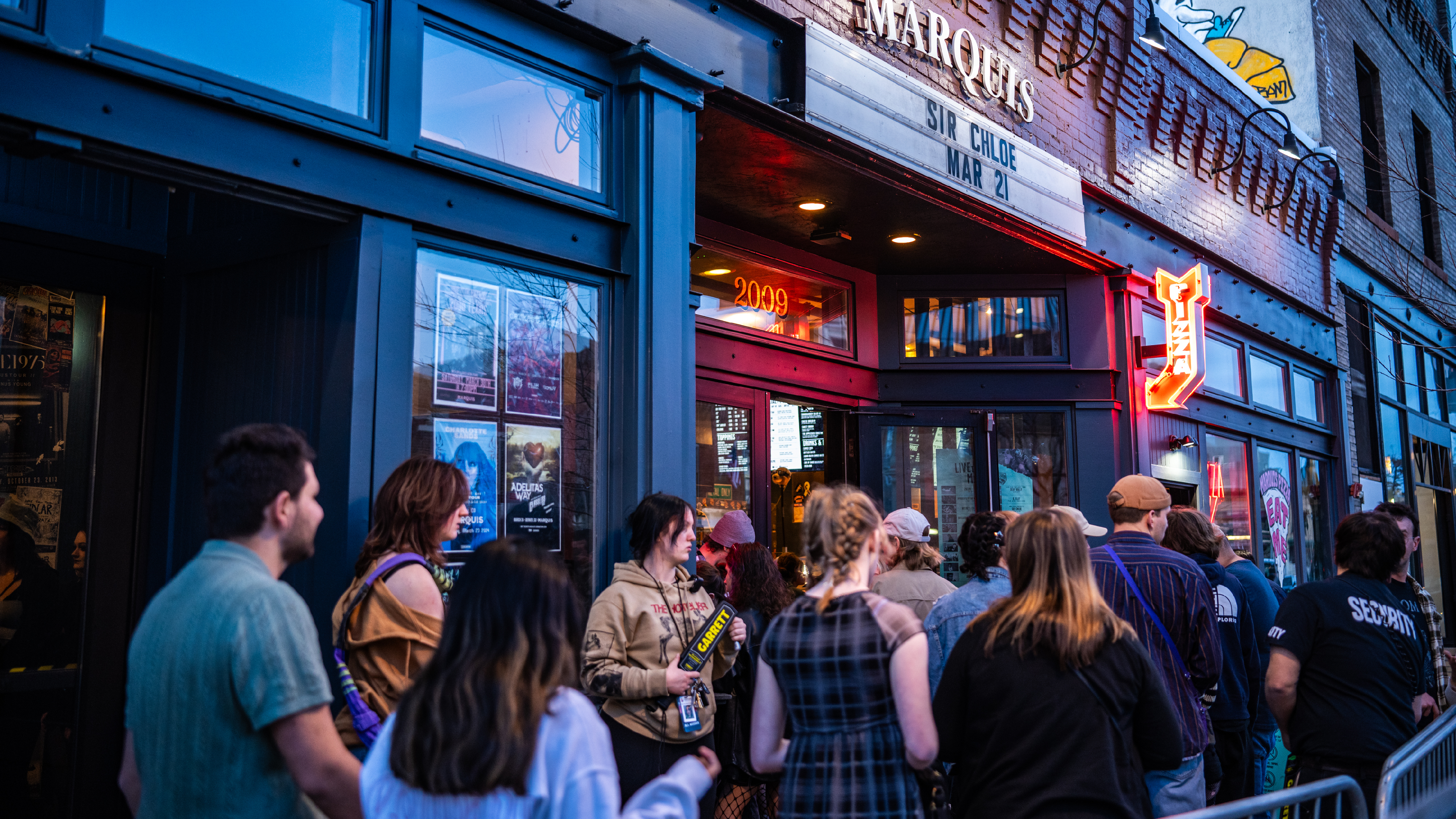People in line to enter a show at Marquis