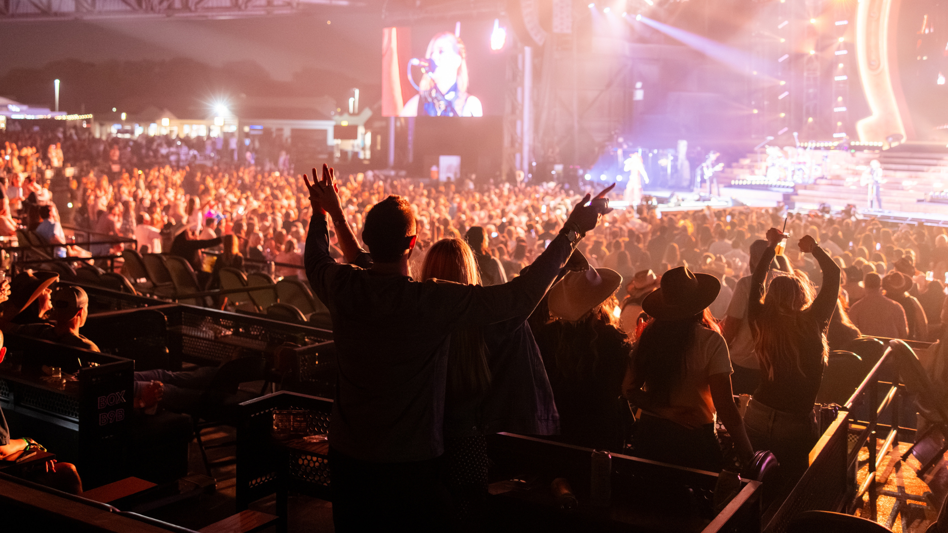Photo of fans looking out at the stage from the Premium seating area while a concert is happening.
Live Nation presents Lainey Wilson at Hollywood Casino Amphitheater in St. Louis, Missouri on October 16, 2025. (Photo by Alive Coverage for Live Nation)