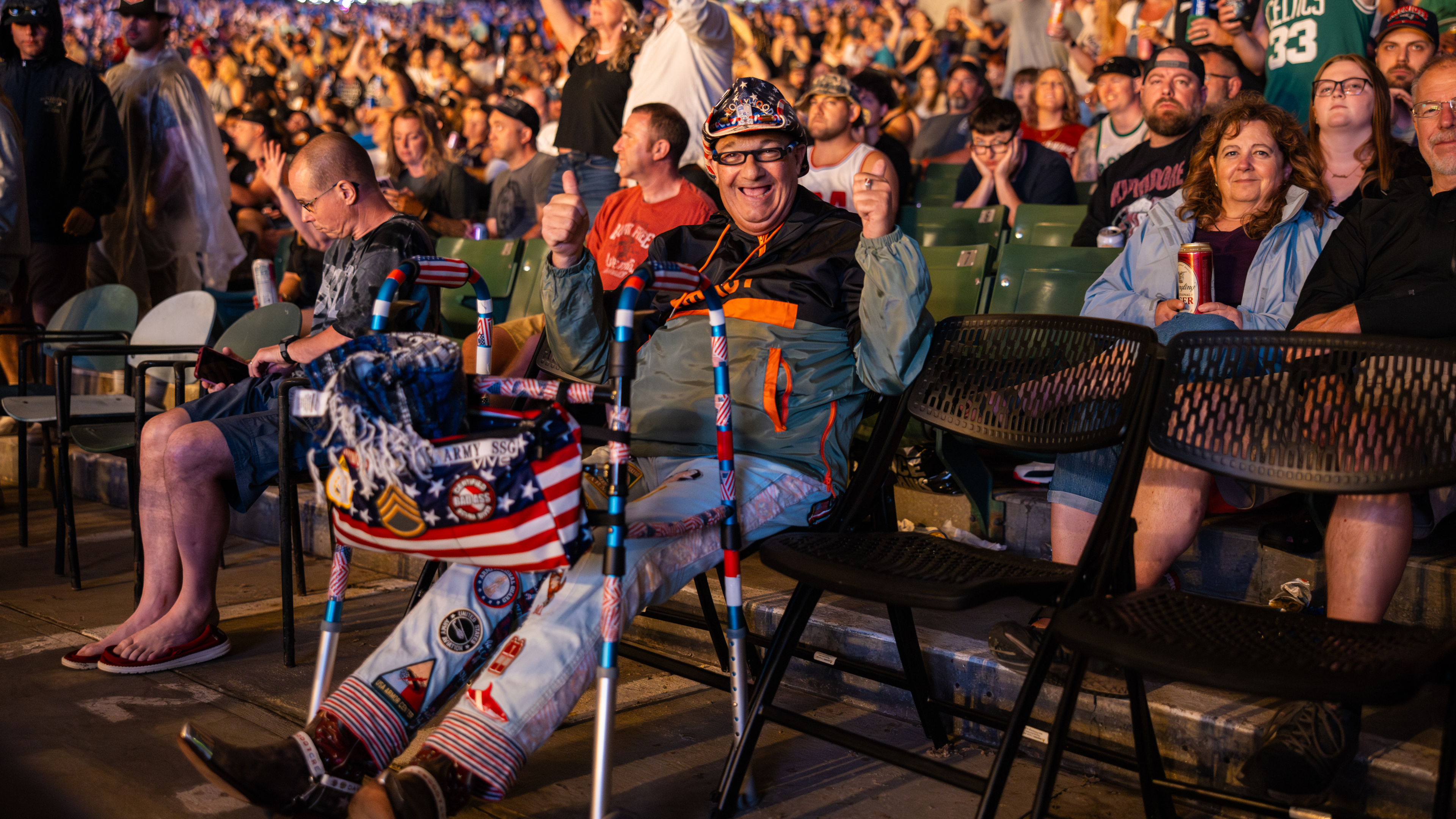 A fan sitting and smiling at the camera