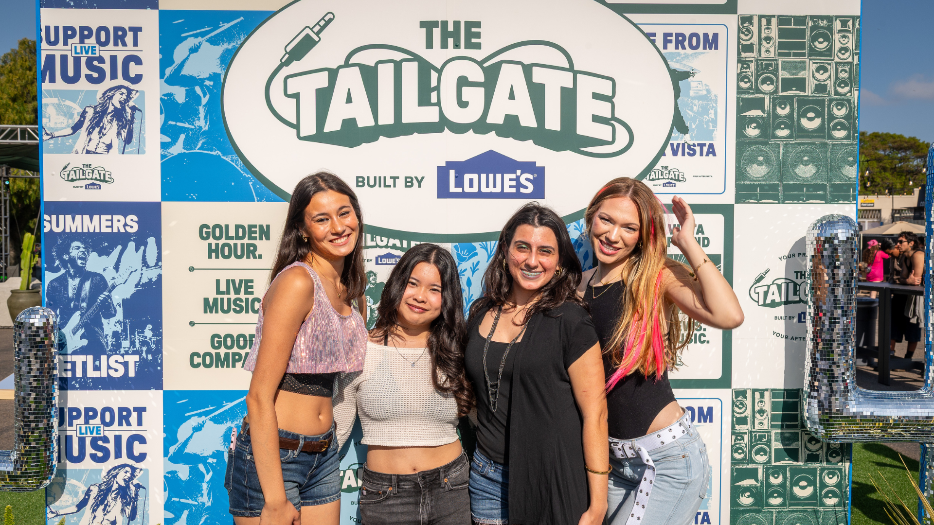 girls posing photo op the tailgate built by lowe's